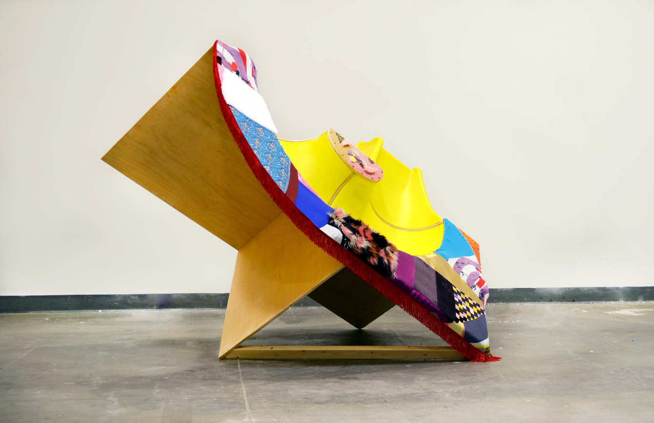 Slide Muscle, 2019 Plywood, 2x4’s, 3 sections of a plastic tube slide, bolts, screws, adhesive fabric, fur, fringe, sequins,foam, paint, tiles 120” x 72” x 84”