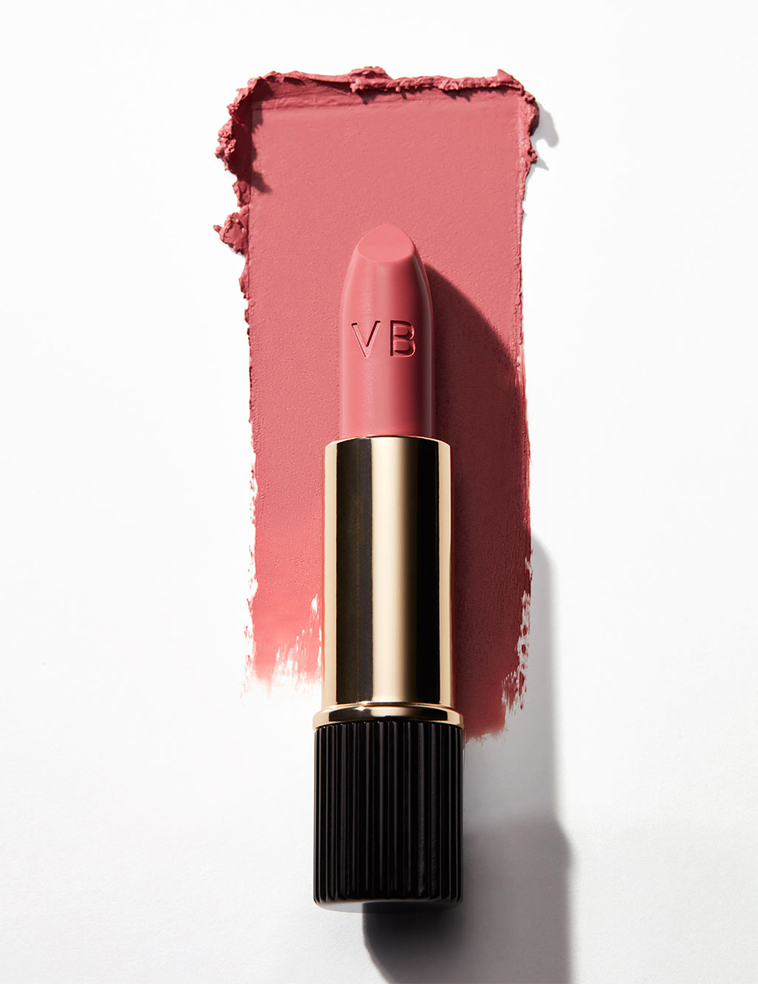 KMA stylist Rachel Haas designs set for photograph of smeared creamy pink lipstick on white background for Victoria Beckham