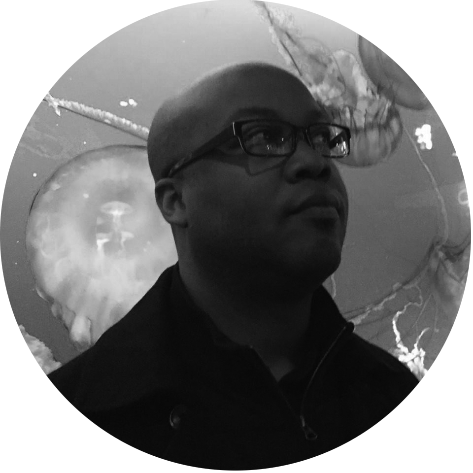 Bald man wearing glasses looking upward