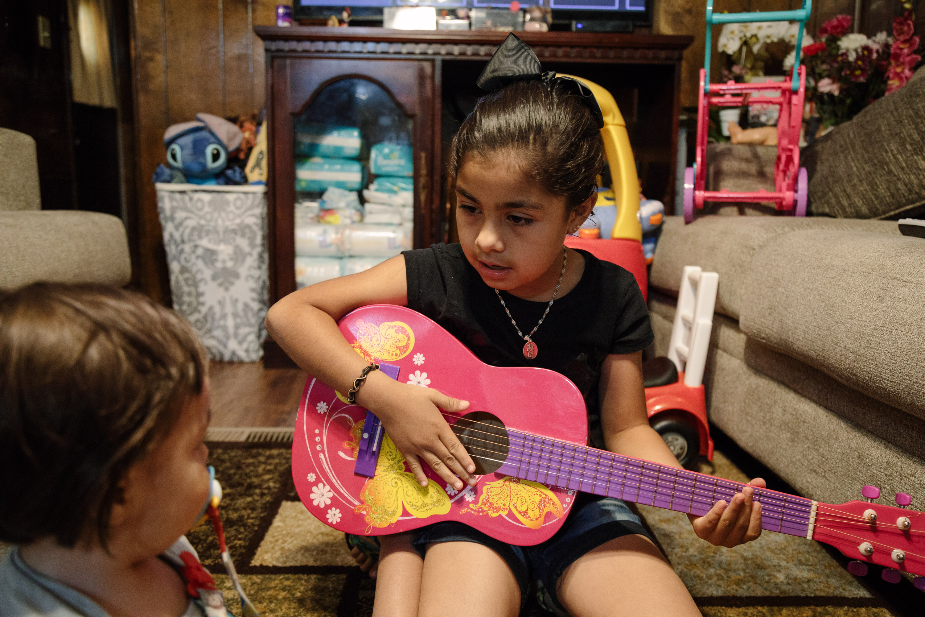 Yemaya, Luis' niece, played with her brother, Sahmet, at their home in Morristown, Tenn.