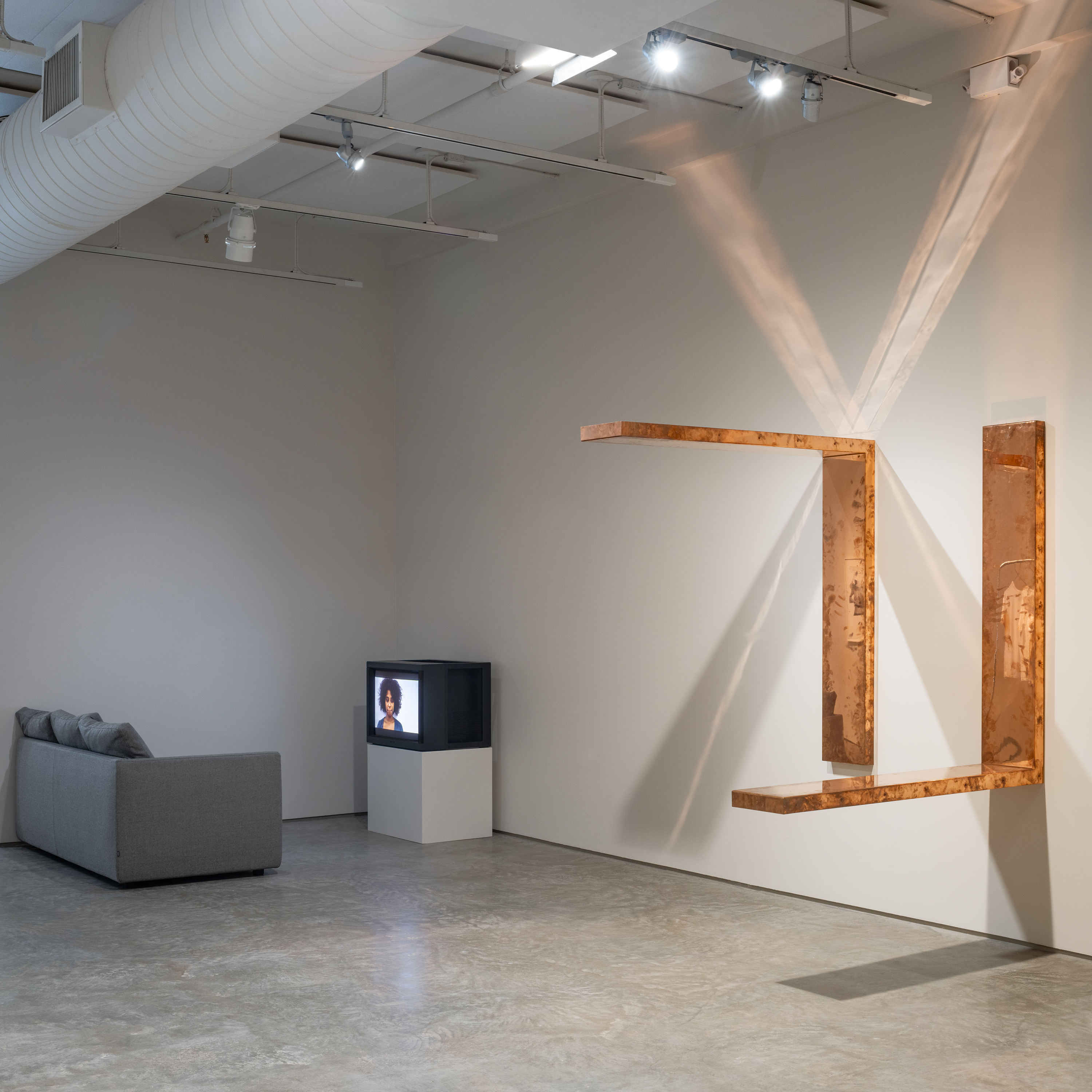 Left: T.J. Dedeaux-Norris, &ldquo;Untitled (Say Her Name)&rdquo;, 2011-2015, Single channel video, duration: 04:46 min. Right: Roman Signer, "Copper Surrogates", 2017-2022. Image by Rafael Gamo.