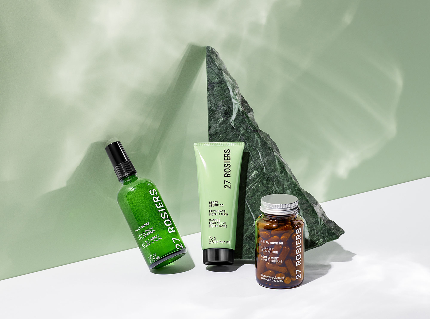 KMA photographer Vincent Gapaillard photographs 27 Rosiers skin care products and a green rock against a green background 