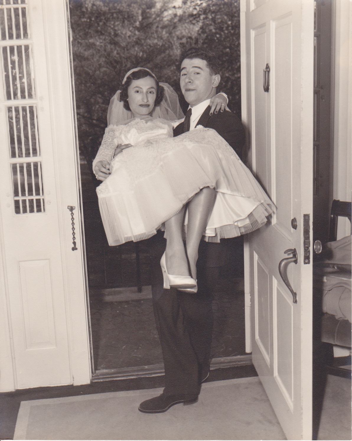 Bert and Esther crossing the threshold on their wedding day.