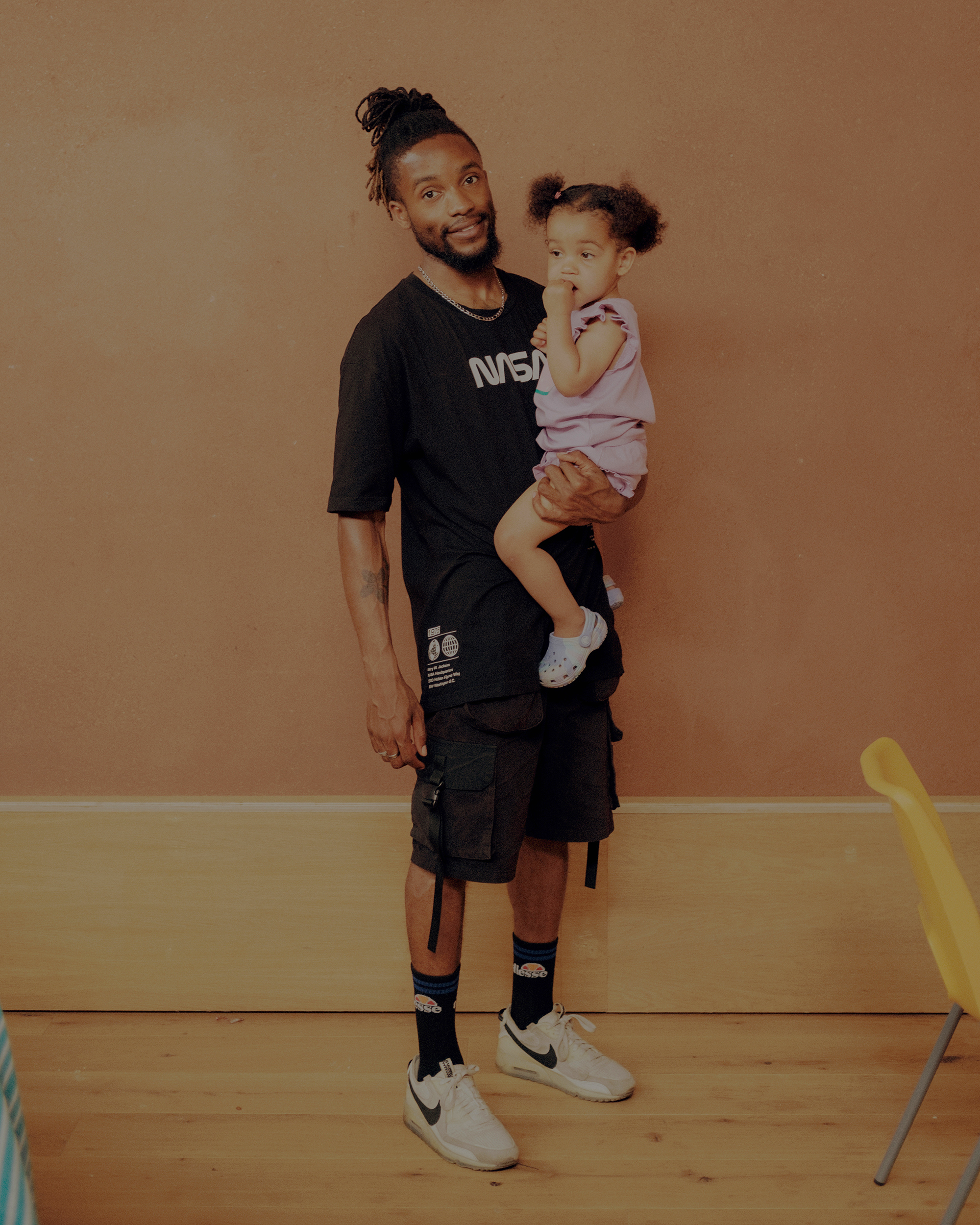 London, United Kingdom, June 24, 2023: Kelsey Hydro Miller holds his daughter Isla in his arms. Kelsey is a dancer and a resident of Barking.