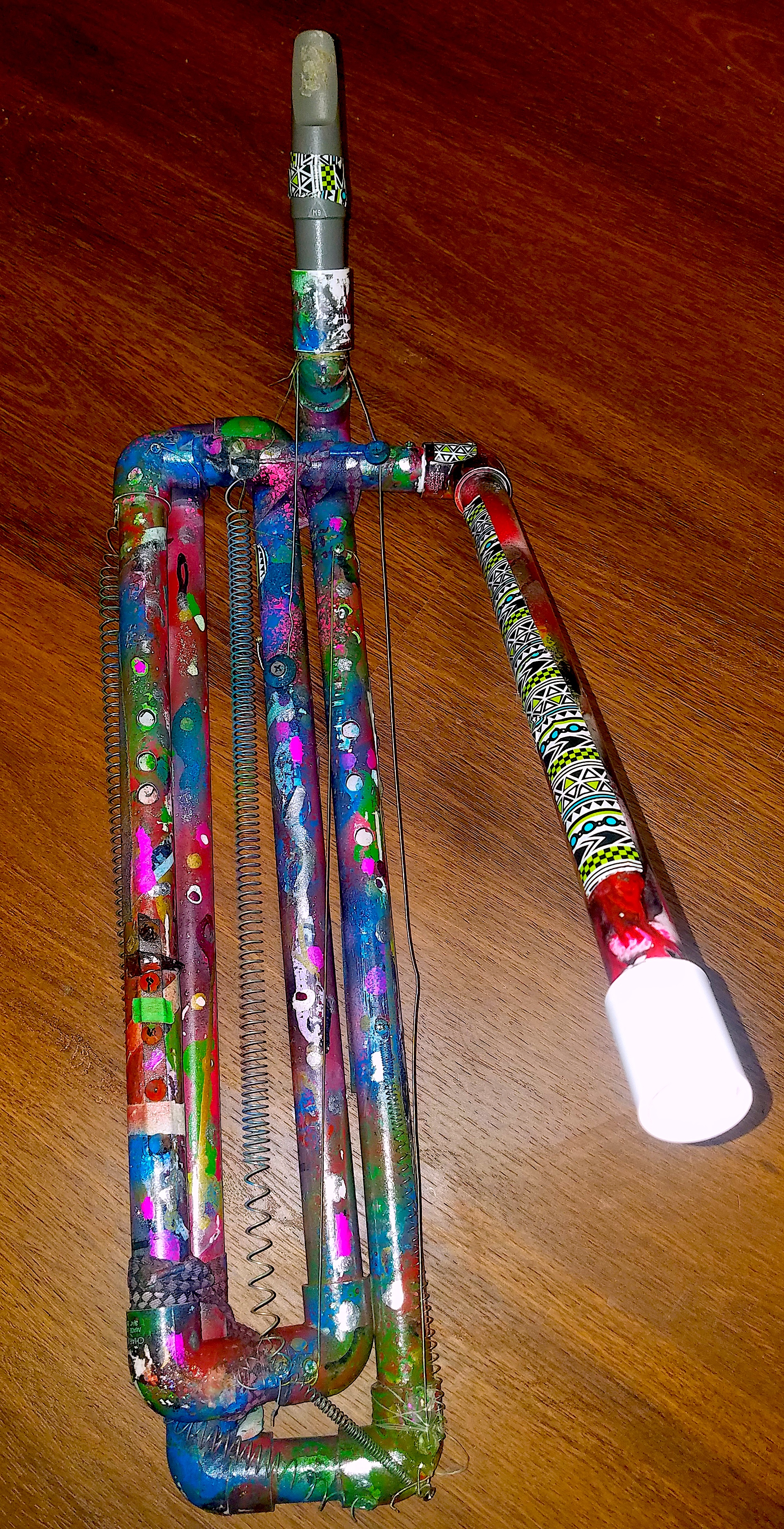 "Rib Cage" front view in common assemblage, a hot steak knife into the pvc makes for the best ways to have fingering holes. the uneven holes make for a wider range of sound. Took a minute to find the perfect bowing spot but its there 2018