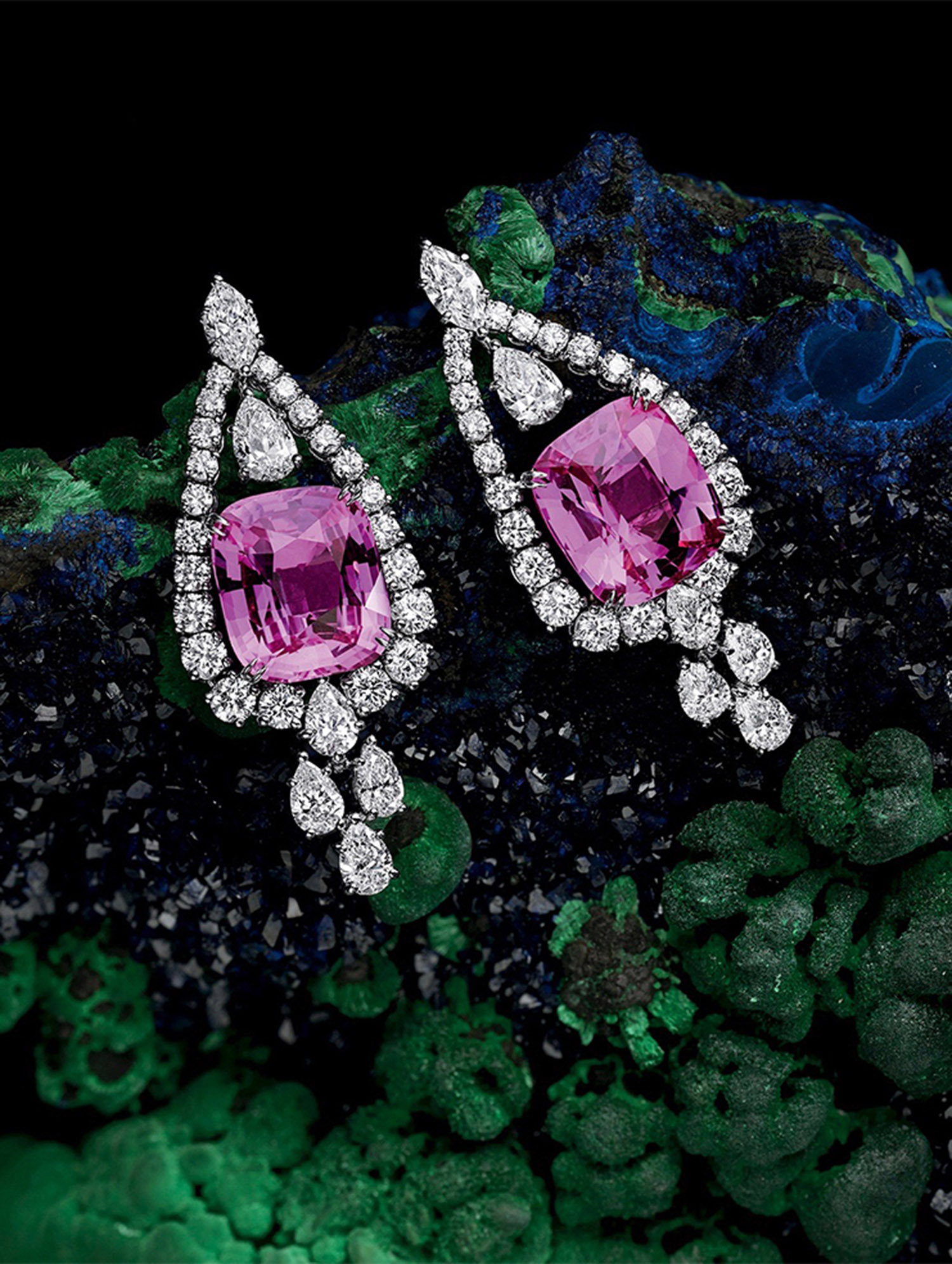 KMA stylist Sara Wacksman designs set for a photo of pink diamond earrings laying on a blue and green background