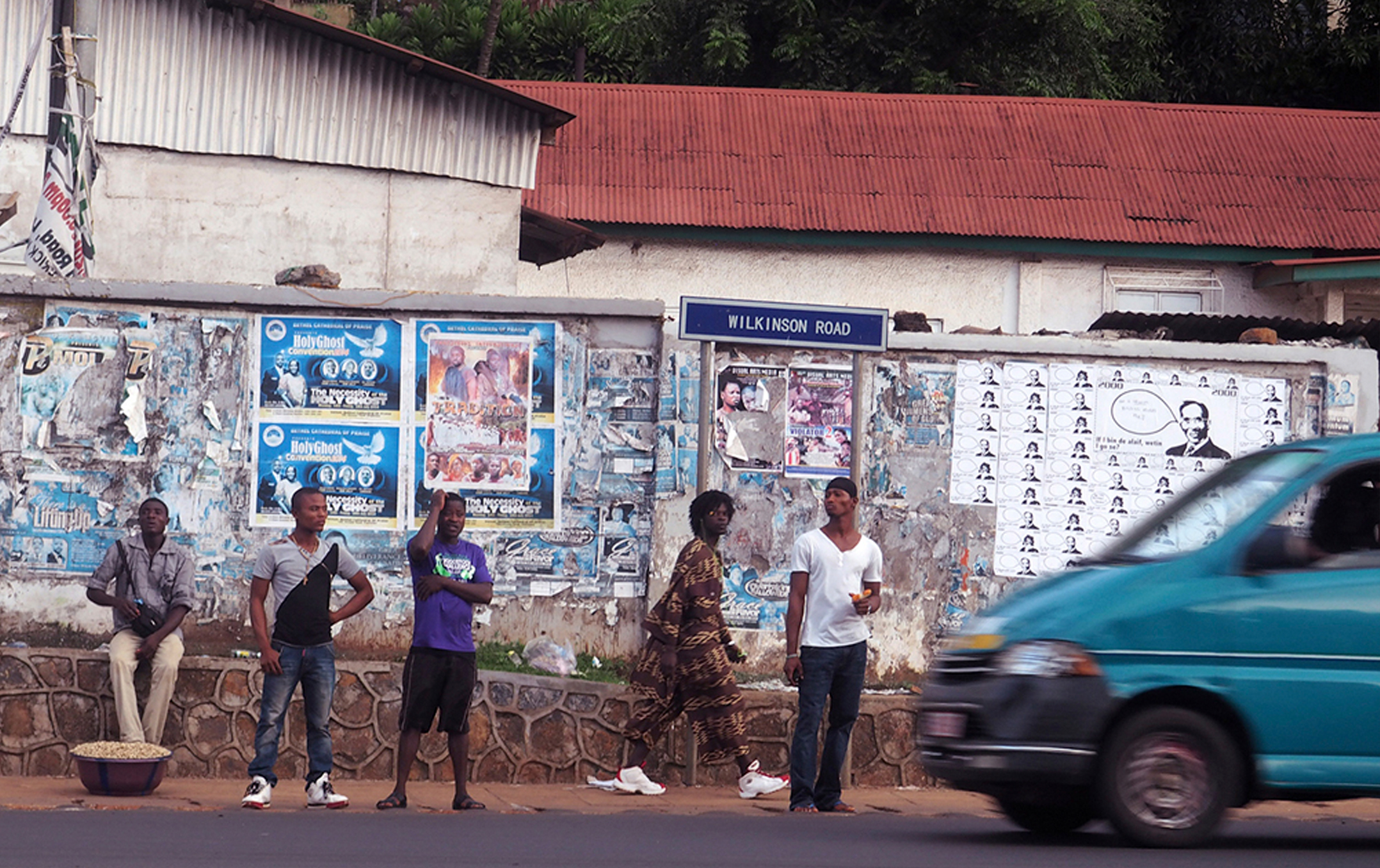 Posters at Taxi pick up point, Wilkinson Road, Freetown, 2014