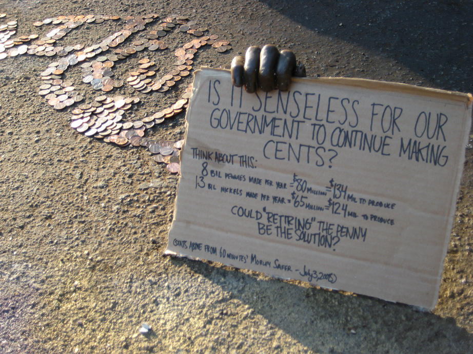 "Give Your Pennies to the Penniless" 2008; wax mold, cardboard and 2000 pennies