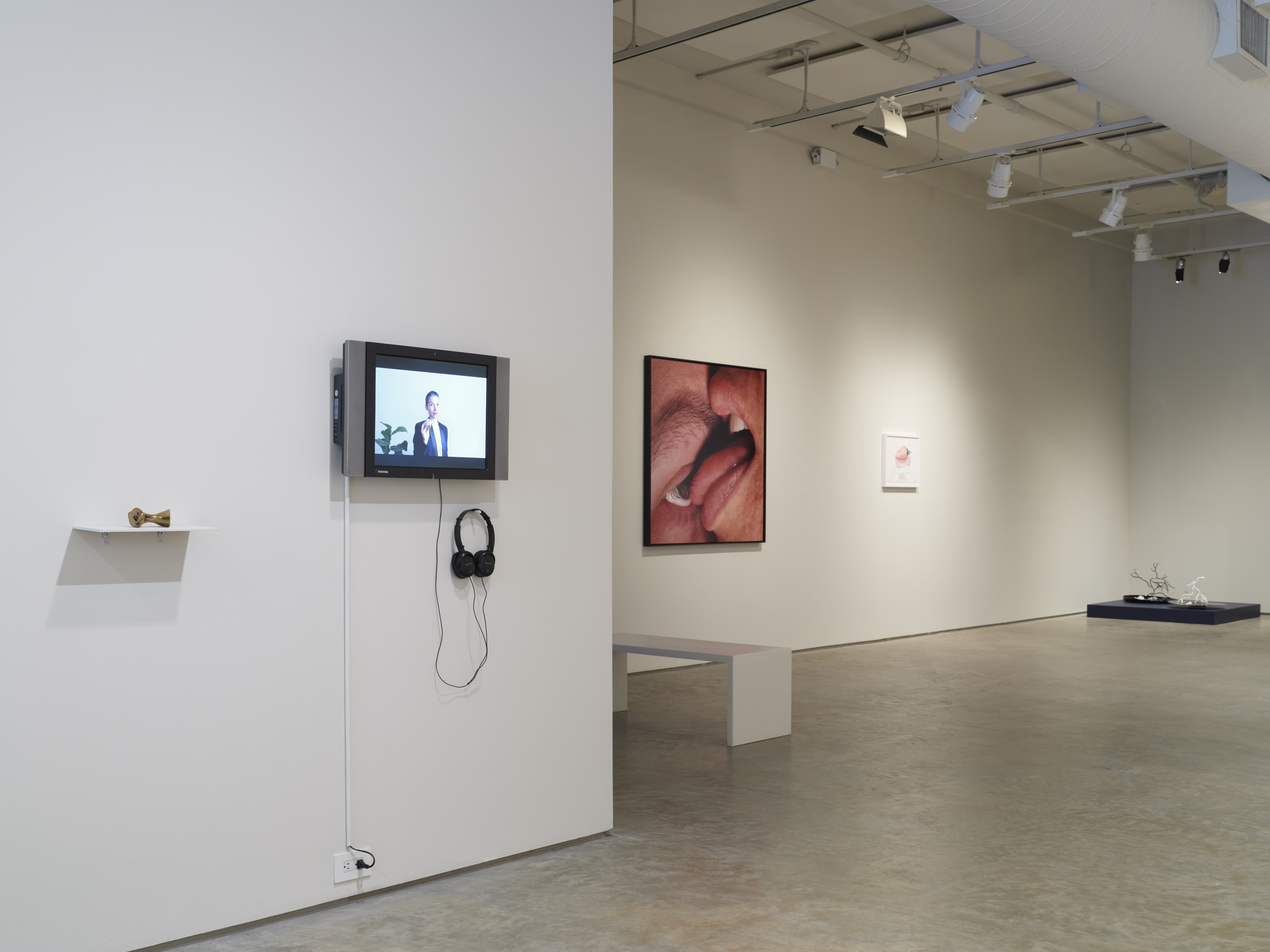 (From left to right) Ana Prvački, Syncope Whistle, 2019. Polished bronze, video, sculpture: 3 x 3.5 x 2 inches, video: 1 min 8 sec. Janine Antoni, Mortar + Pestle, 1999. Chromogenic print, 48 x 48 inches.  Ana Prvački, Support Shell, 2021. Watercolor on paper, 14.9 x 18.9 inches.  Goldie Poblador, Porites Oil Slick Coral, 2025. Glass, scent. 20 x 20 x 17.5 inches; Porites Bleached Coral, 2025. Glass, scent	, 17 x 20 x 19.5 inches. Scent by M Dougherty.  Photo by Flaneurshan.studio