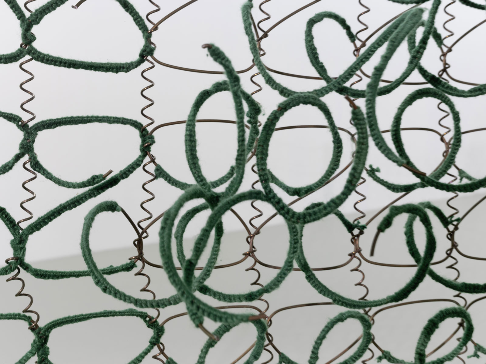 Bronwyn Katz,  Chateau vert  (2018) | Salvaged bed springs, wool and mild steel, 200 x 385 x 192 cm | Image courtesy of Palais de Tokyo and André Morin (detail)