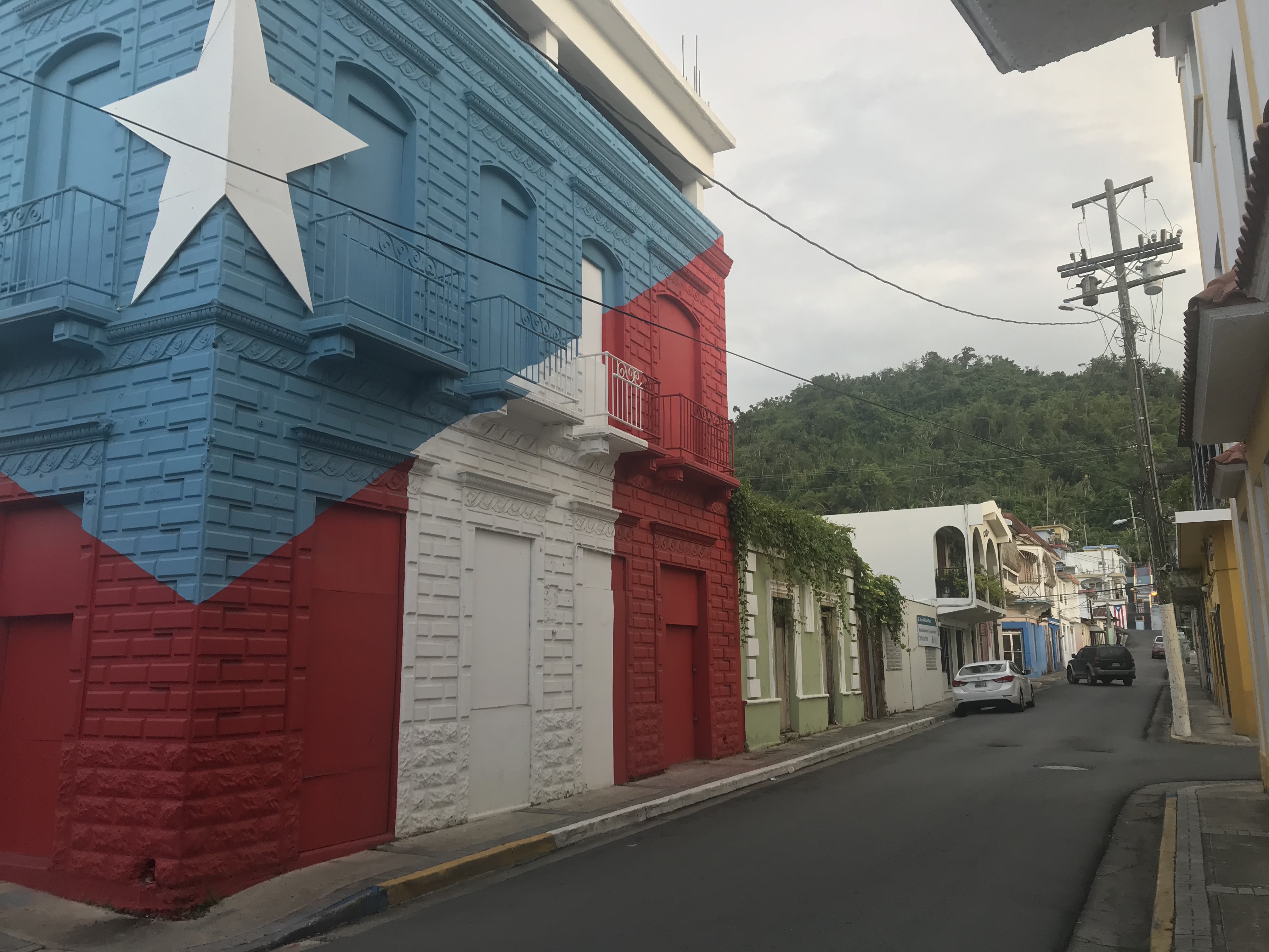 Puerto Rican flag painted on a corner site, Utuado.