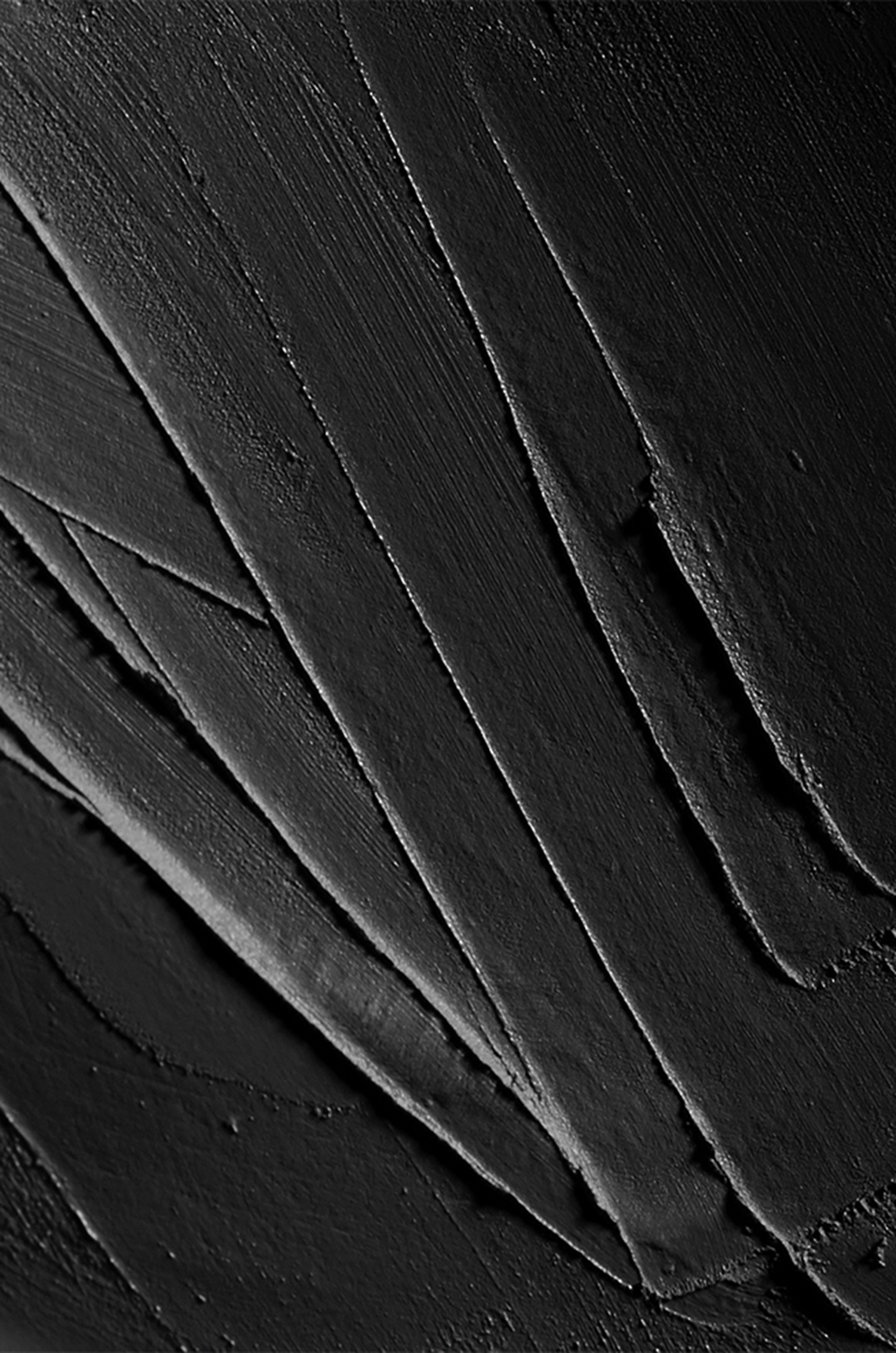 KMA stylist Sara Wacksman designs set for photo of creamy black Kjaer Weis mascara smeared in a random pattern 