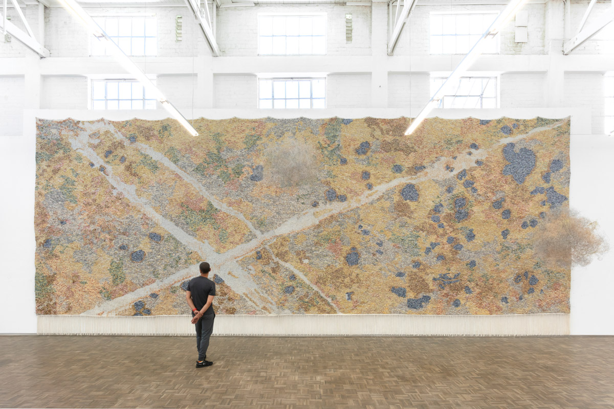 Igshaan Adams, Bonteheuwel / Epping (2021) | Wood, painted wood, plastic, bone, stone and glass beads, seashells, polyester and nylon rope, cotton rope, link chain, wire (memory and galvanised steel) and cotton twine. 1170 x 325 x 495cm