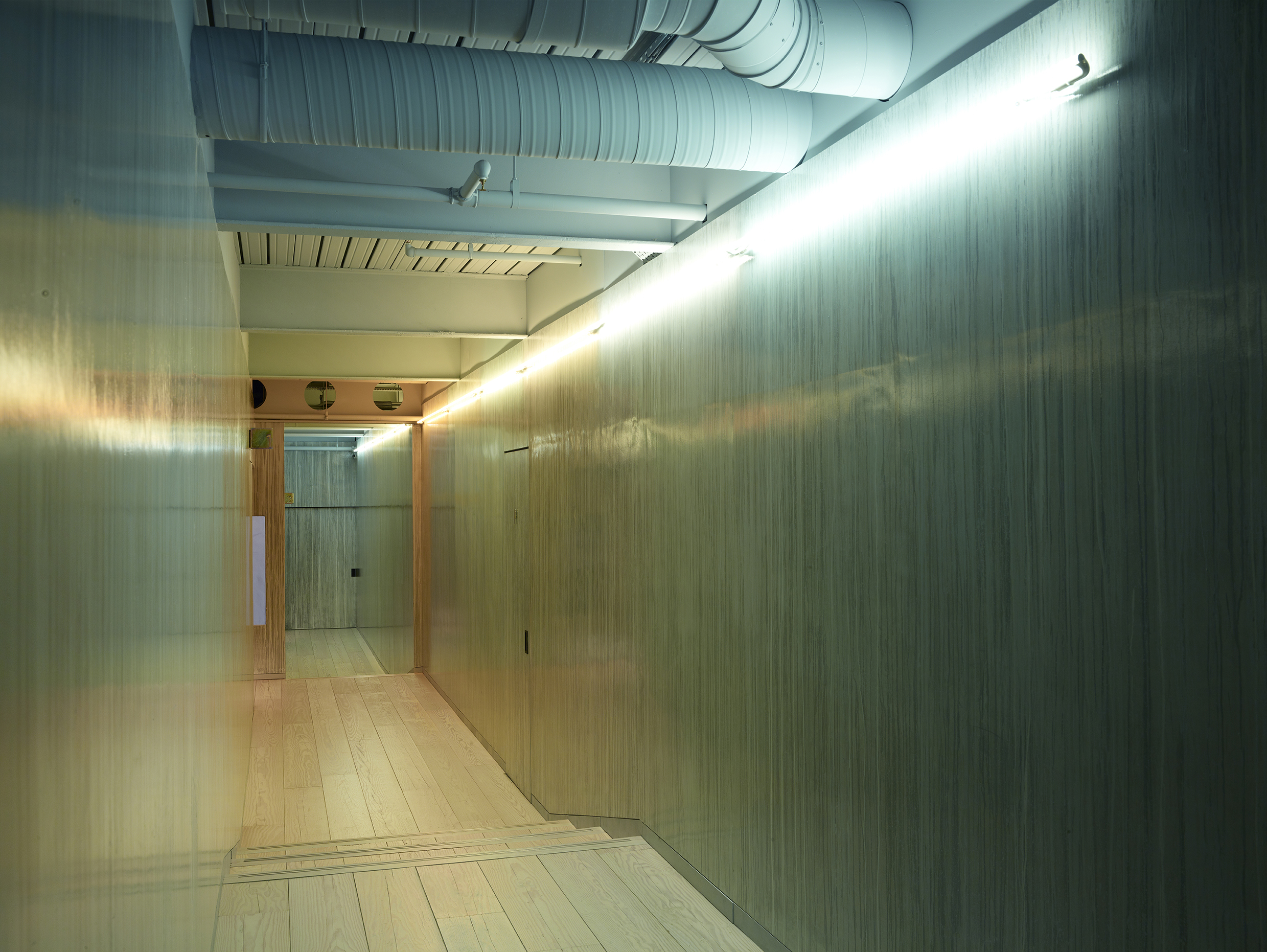 Shoreditch corridor; dripped paint wall by Annie Millar / cold cathode lighting 