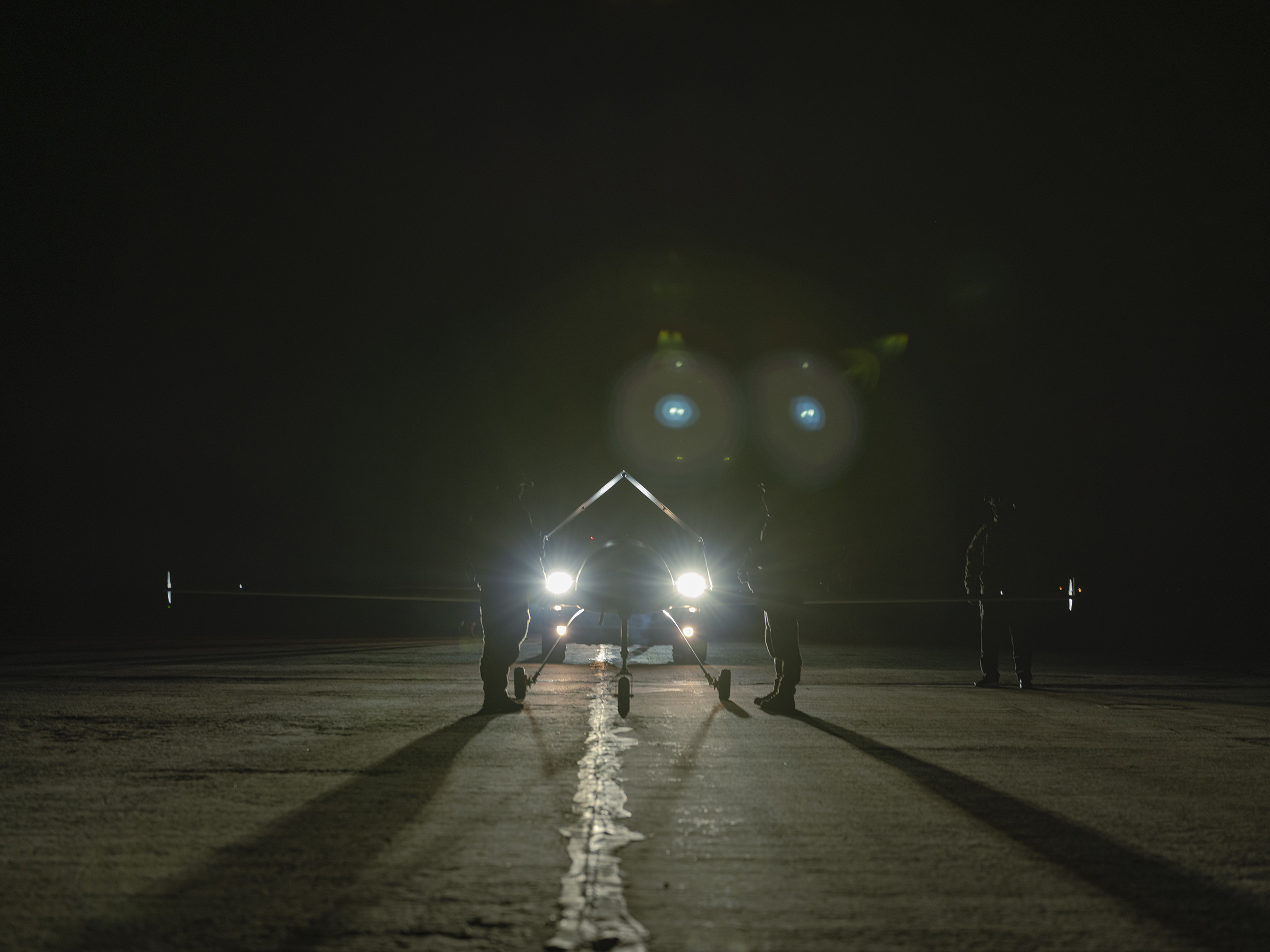 Service members of Ukraine's 14th UAS Regiment launch long-range drones from an airfield in Ukraine on March 12.