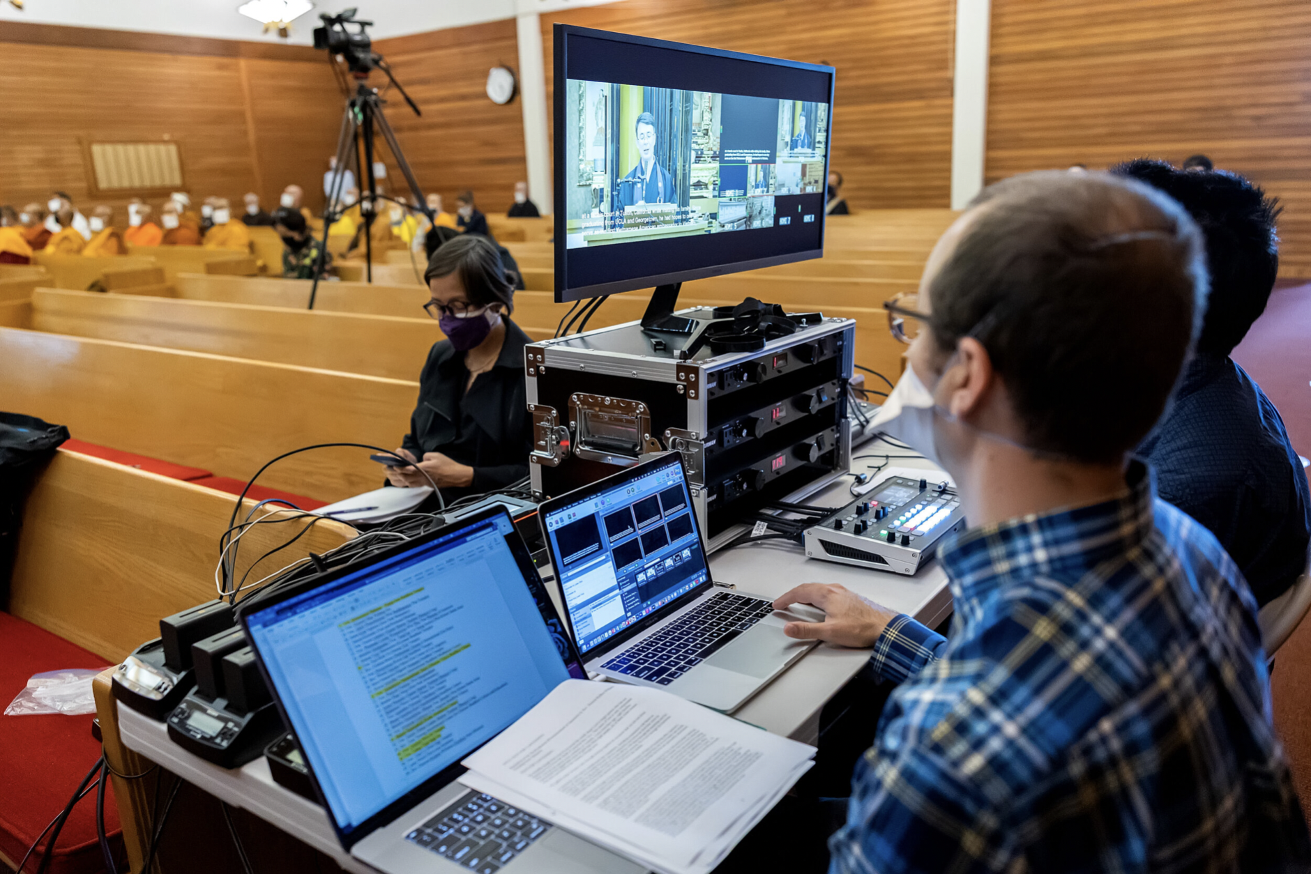 (From front to center) Dr. Trent Walker and Evan Kodani at the livestream station; Sunyoung Lee assisting with behind-the-scenes logistics. May We Gather ceremony at Hongwanji Temple in Los Angeles. Photo by Tauran Woo.