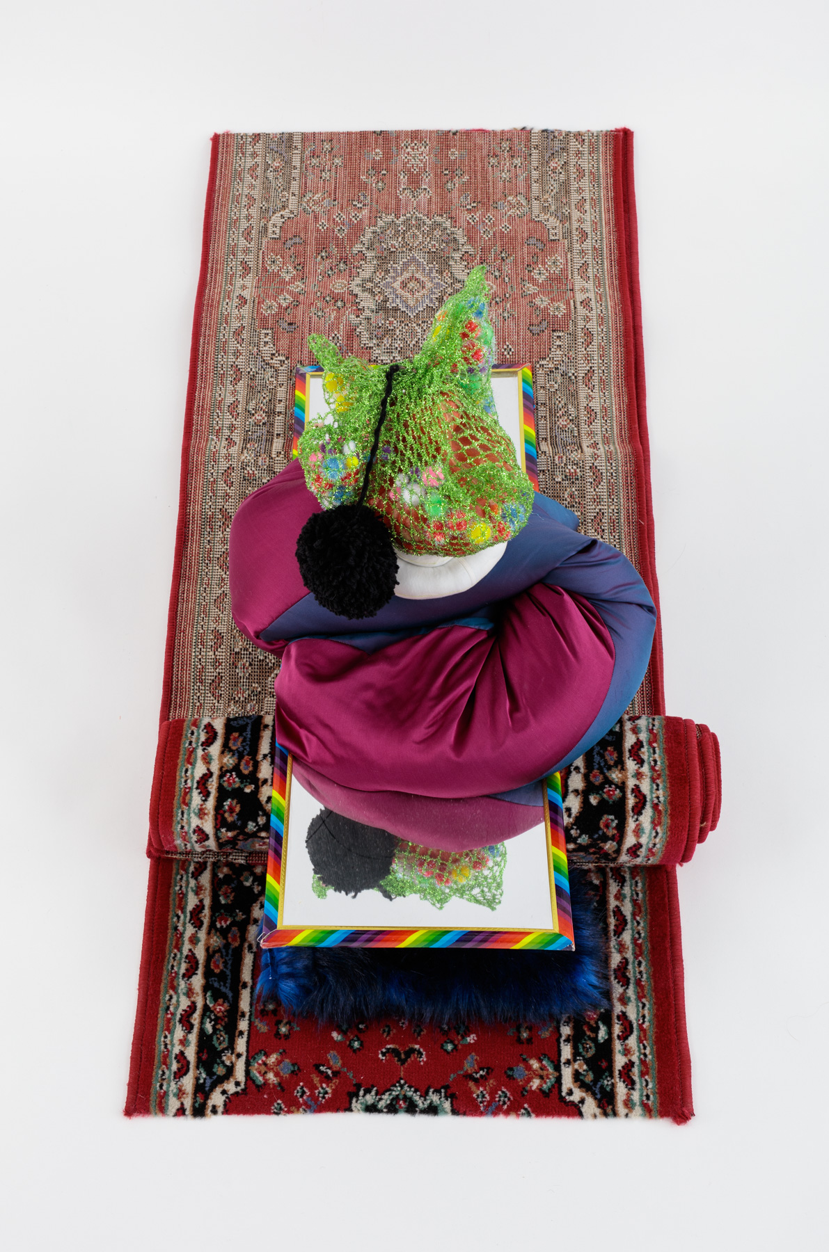 Crafty Reflection, 2017, Fake gourd, pompoms, silk taffeta, mirror, runner rugs, thread, polyfil, bean bag beads, faux fur, stretch tinsel ribbon, 56 x 23 x 15 inches