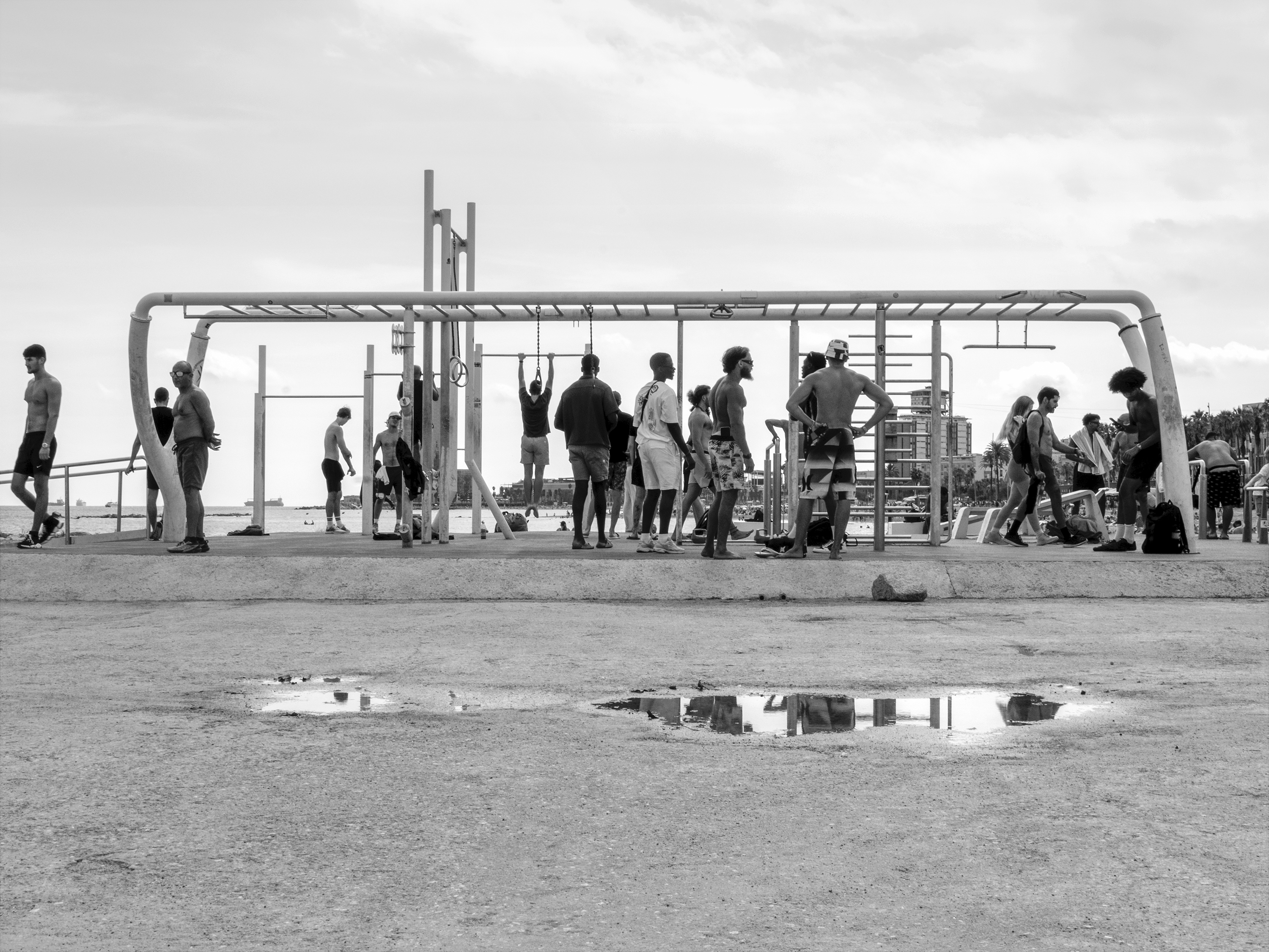 Bodybuilding area and puddle on Somorrostro beachBarcelona, Spain, 2025photography, bw, single
