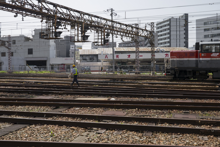 view of a man walking away // osaka