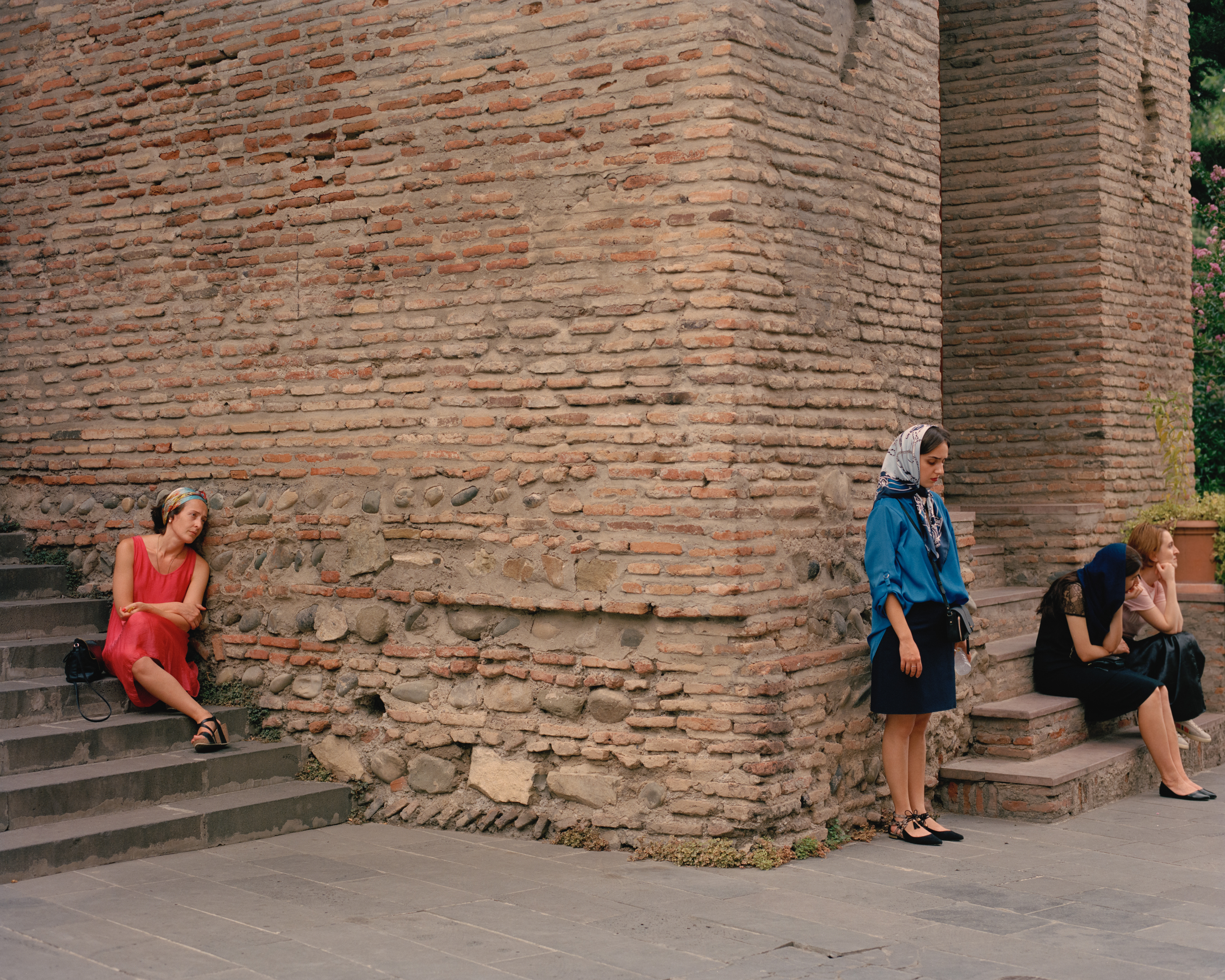 Women waiting in front of a Church. Tbilisi, Georgia