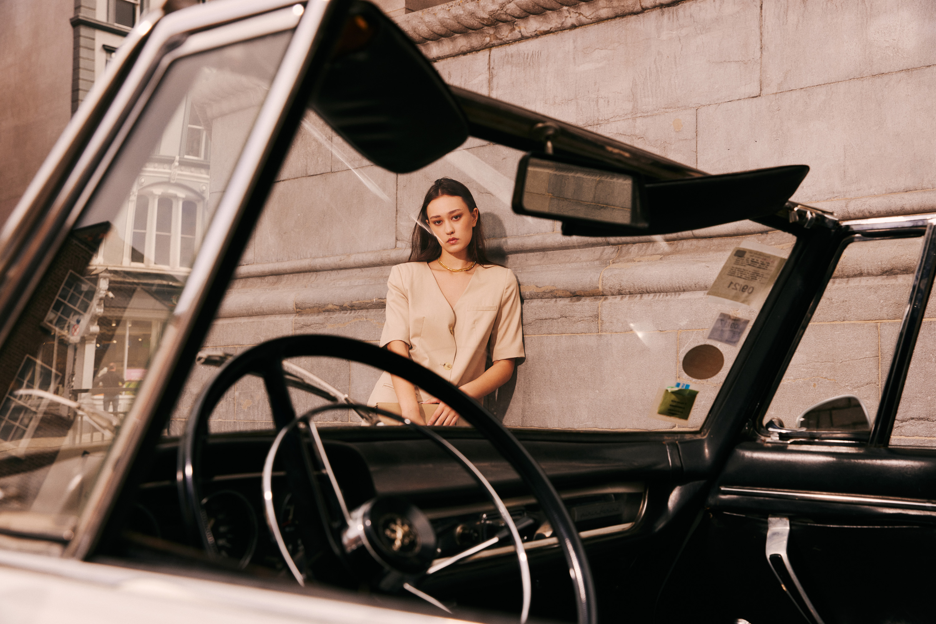 Luxurious fashion editorial photoshoot in Dublin, Ireland, featuring a stunning model in vintage clothes. Photographed in the city's trendy French cafes, this photography showcases the elegance of high-end fashion and the charm of vintage clothing. Captured by a skilled photographer, this editorial is sure to impress.