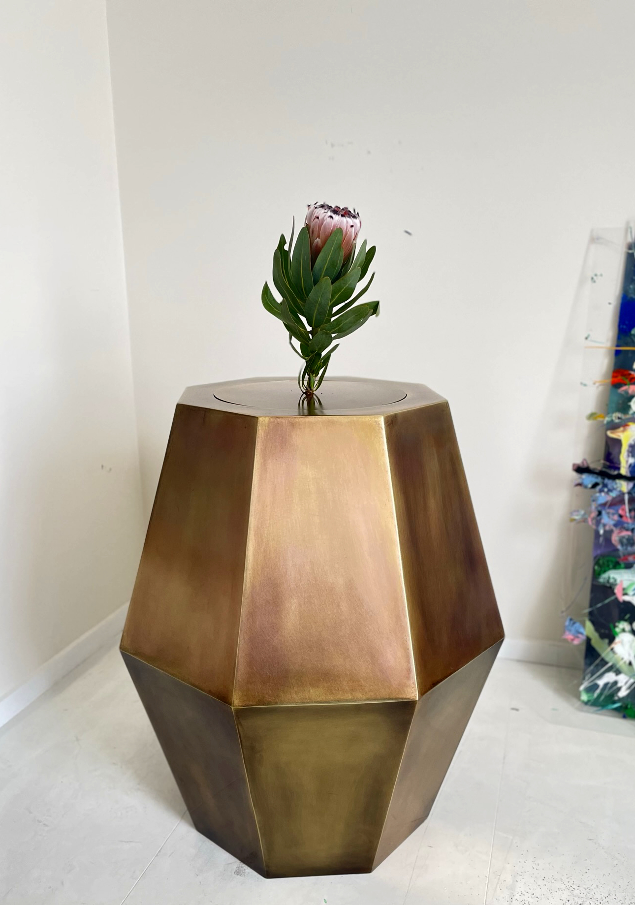 Kirby BourkeGeelong, Australia75cm x 75cm x 85cmAged brassThe 'Large Hydrangea Vase' is a play on scale.How big can a vase be before its not a vase?Answer: Infinitely. As long as it can hold a flower its a vase. Just as art doesn't exist without the viewer, an object isn't a vase without the flower.
