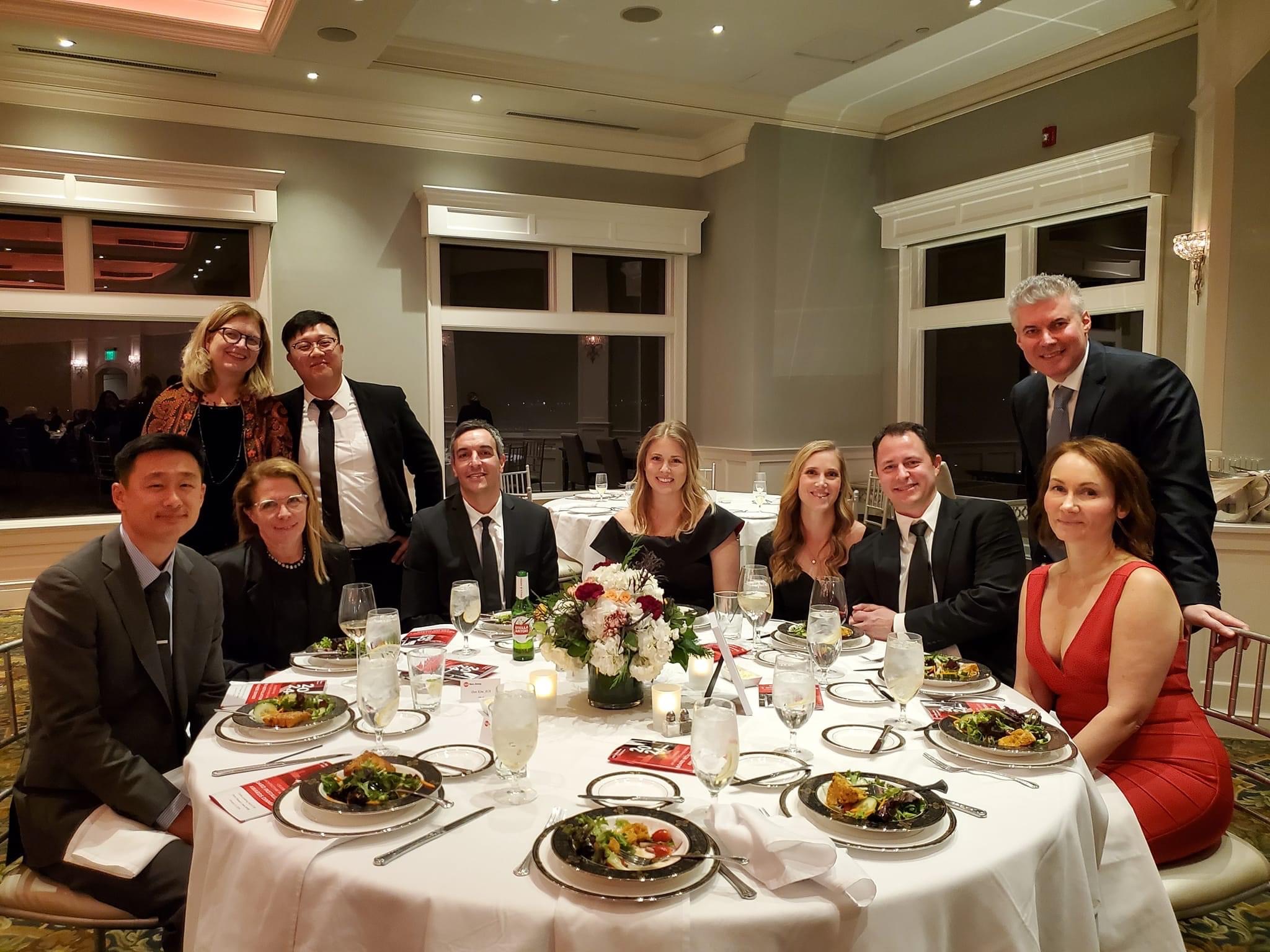 Photograph of the team celebrating the Brigantine Marina and Paddle Club AIA Honor Award at the annual Design Awards Gala dinner.