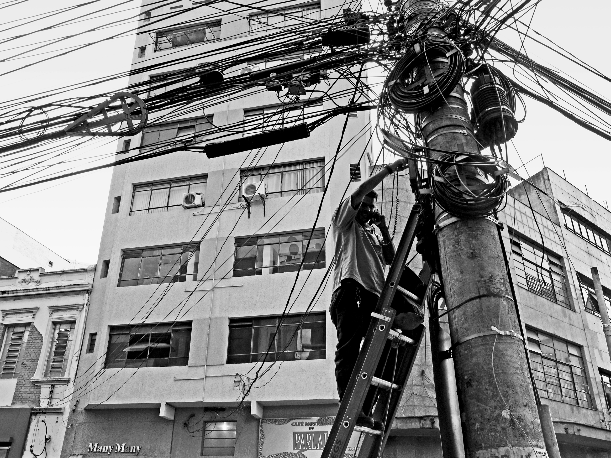 Telephone company employee checking the linesSão Paulo, Brazil, 2013photography, bw, single