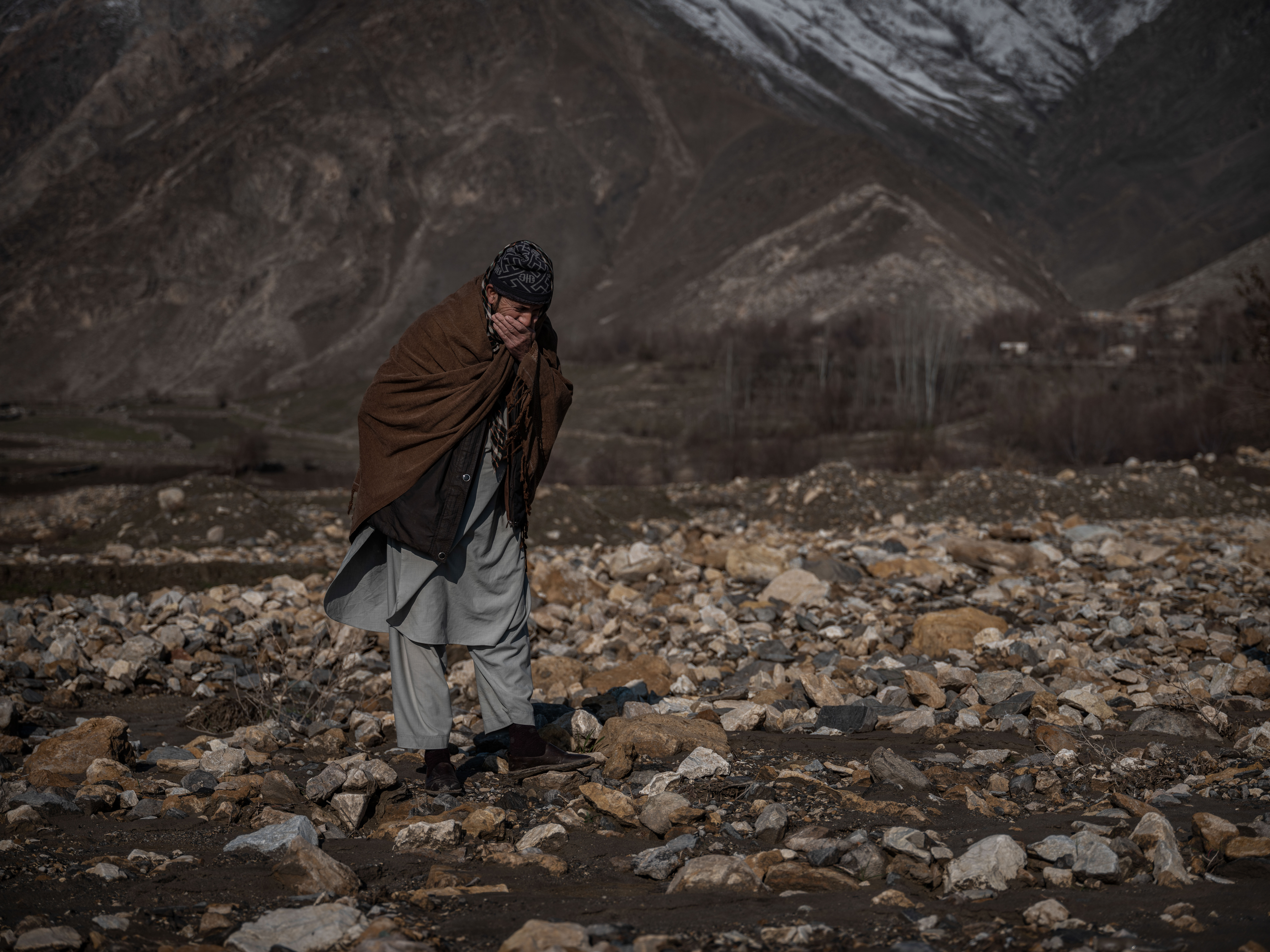 Farmer Abdul Qudu's farmland is now covered by a deep layer of stones. Eighty (80) percent of his farmland is destroyed due to flash floods in Olar village in Baharad district of Badahkshan.