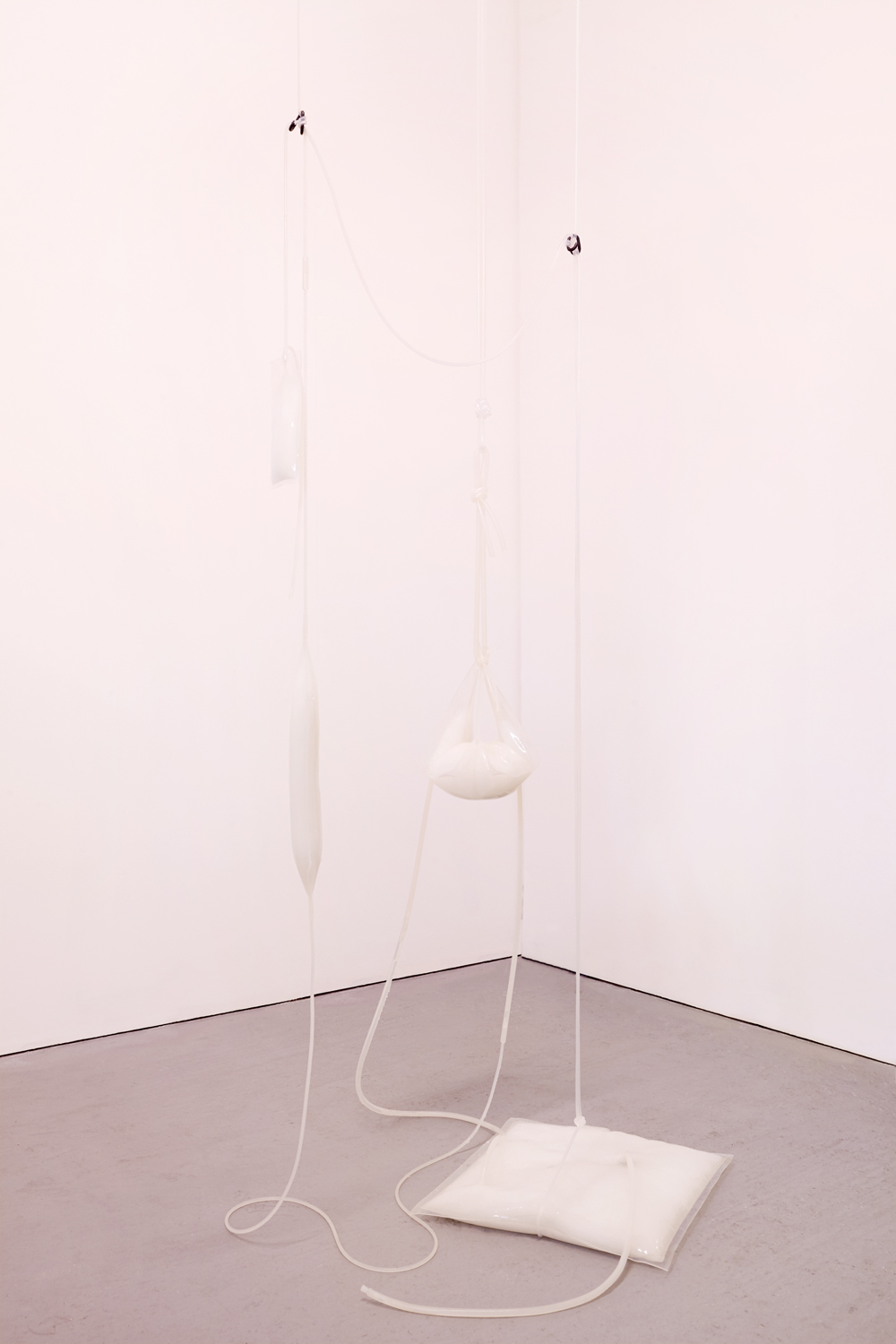 An Equal and Opposite Reaction, 2018, [various dimensions], Memo Gallery, London    Silicone, sodium acetate trihydrate, steel, bottled water and pink light filter 