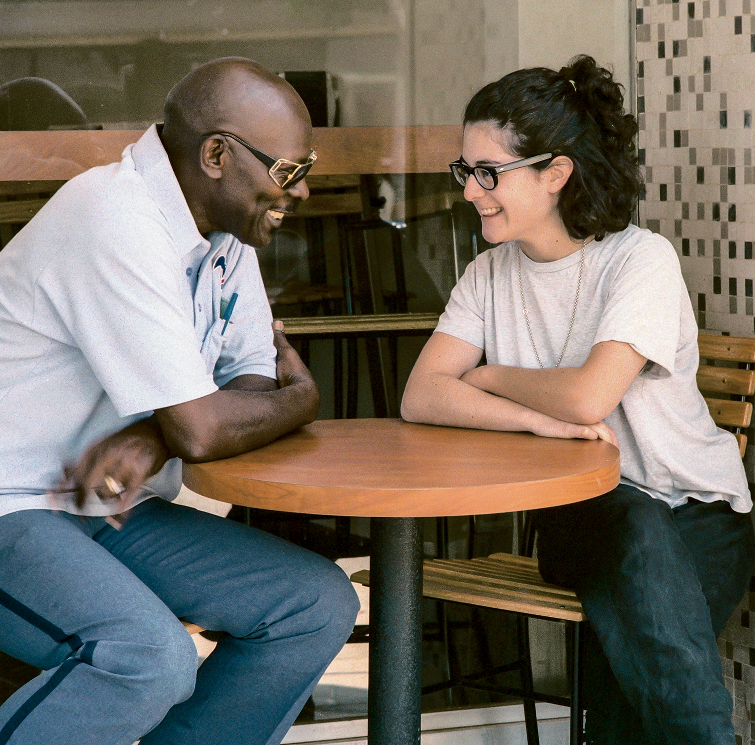 Self-Portrait with Mailman, Bagel Store, Hollywood, 1995. C-print; 10 &times; 10 inches