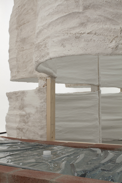 Untitled, 2014, variable size, plaster, burlap, plastic sheets, bricks, plastic emergency water storage bag, water