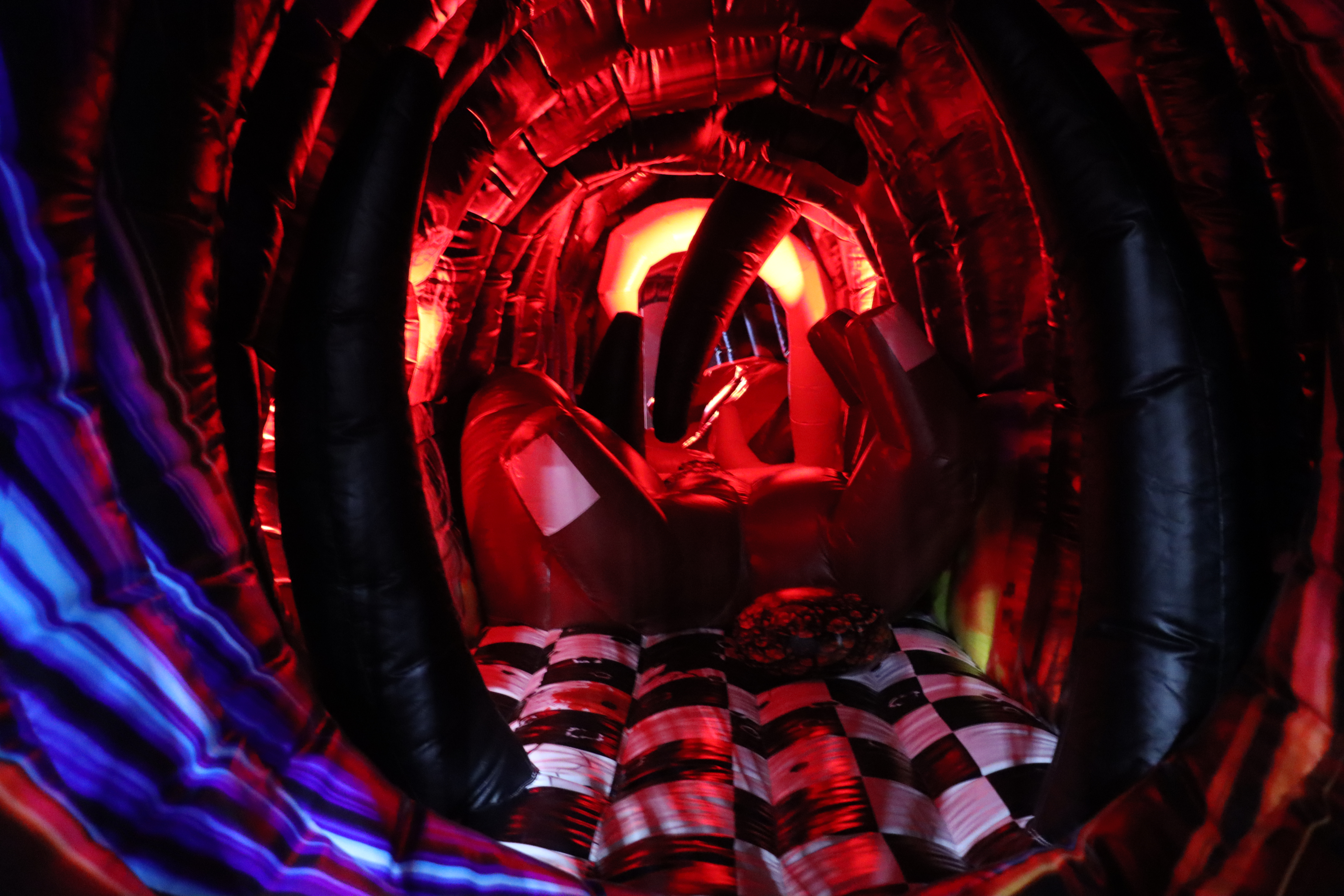 FIRST SECTION: A "Rain" swirl entrance tube & Devil May Cry inflatable obstacle course.