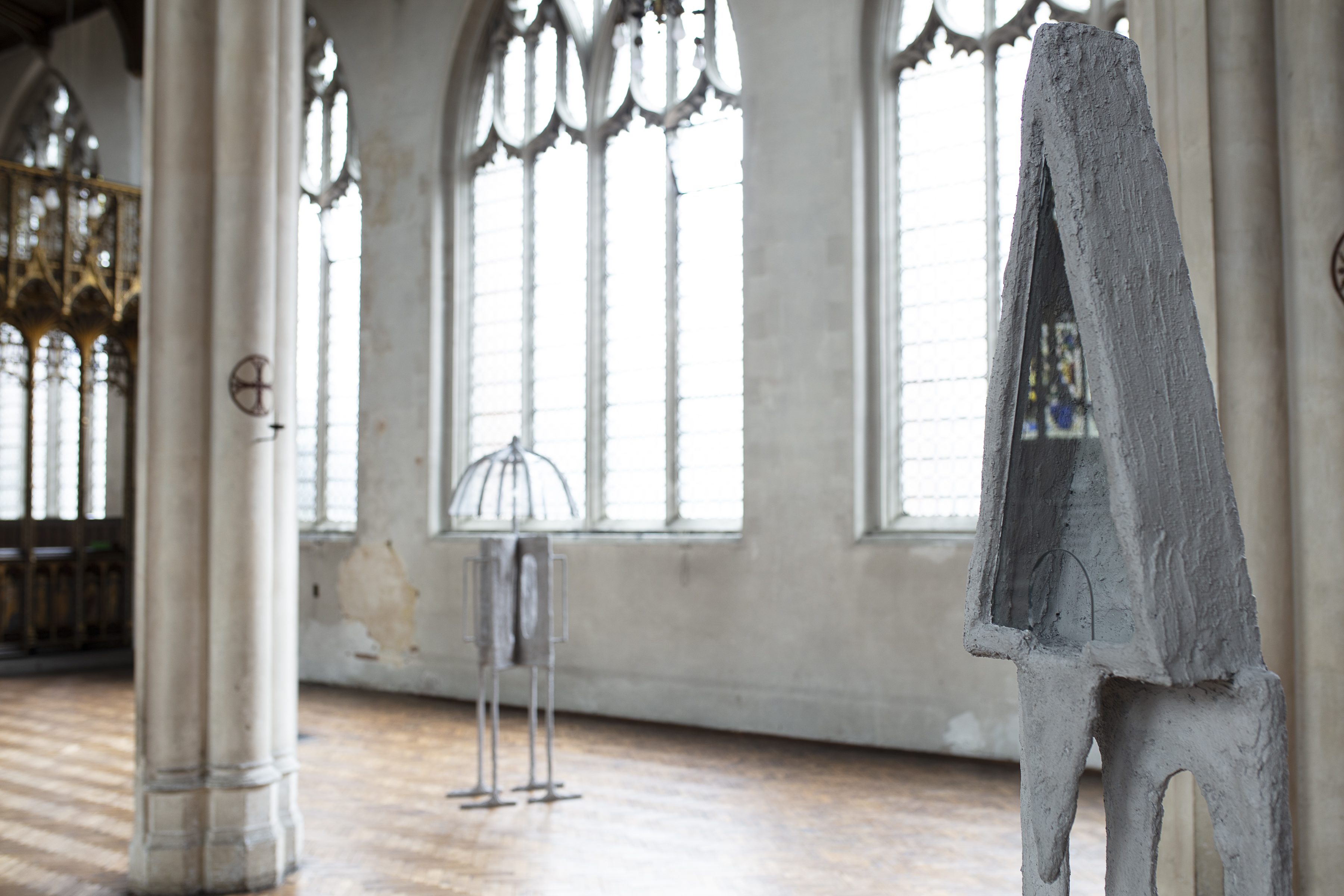 The Crowd (Part 1 -  St Cyprian's Church), 2020, steel, plaster, burlap, sand, pigment, glass, shower curtain hooks, umbrella