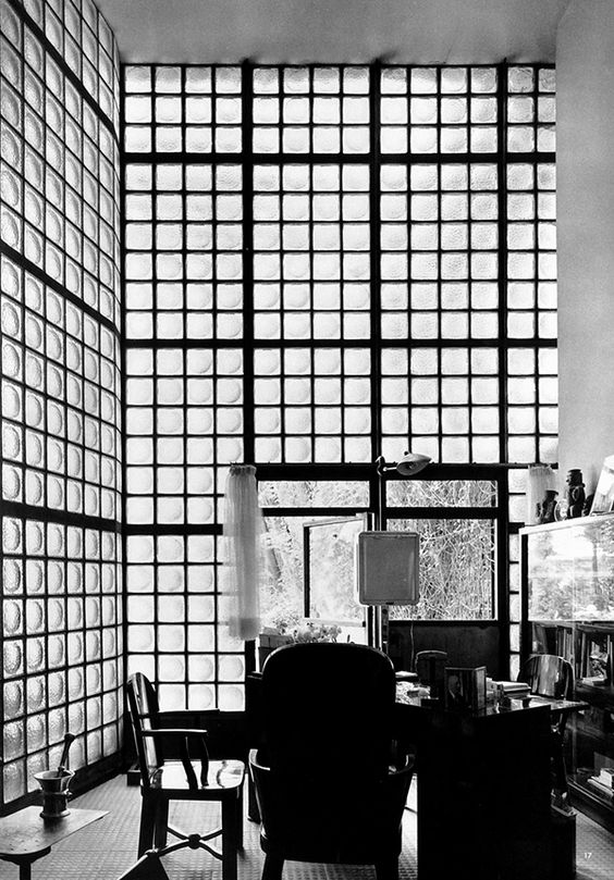 Black and white image of the bathroom inside the glass brick room.