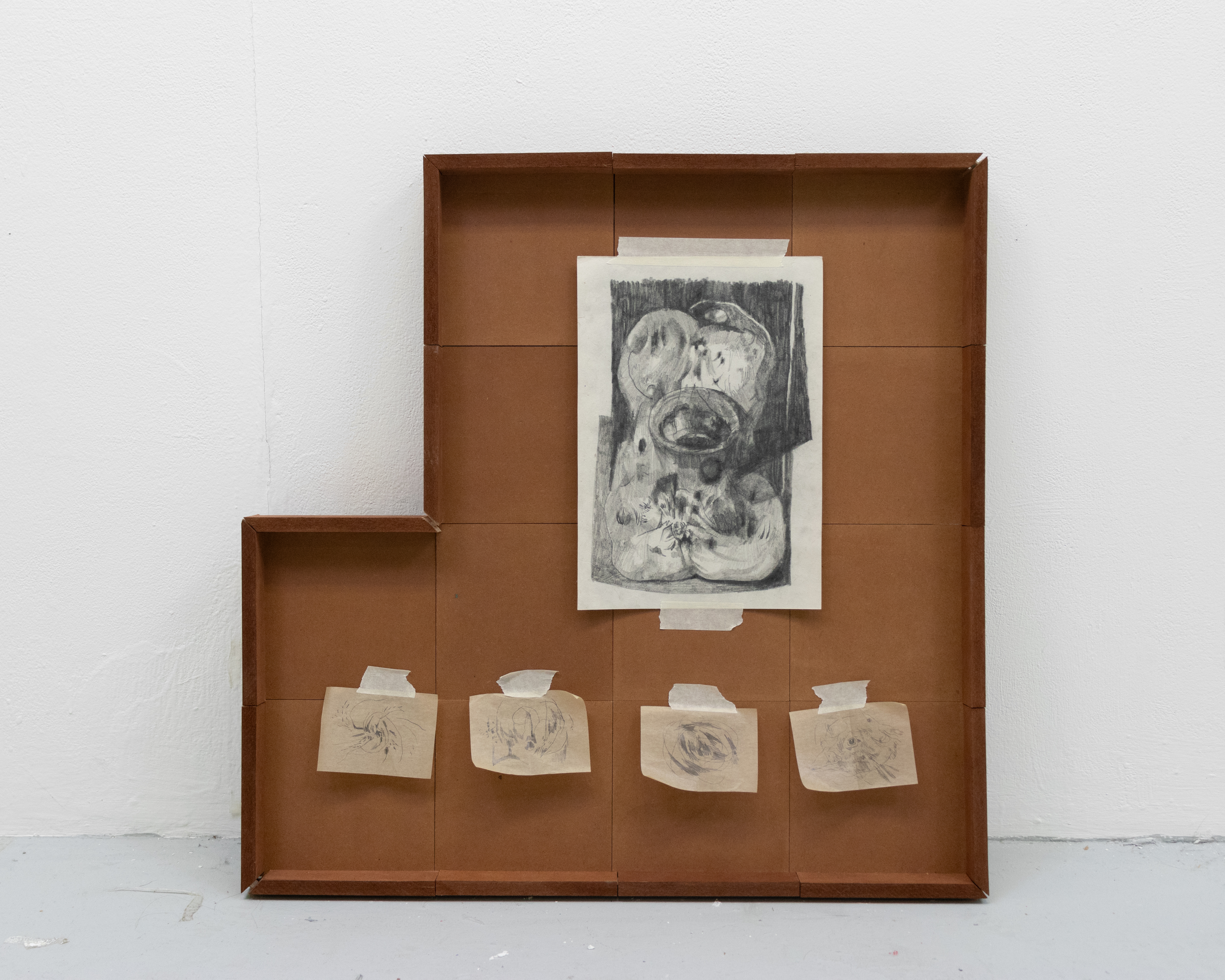 Minor Composition 1, 2023. Graphite on paper and blotting paper in stained MDF frame with masking tape, 24x24in at largest point.