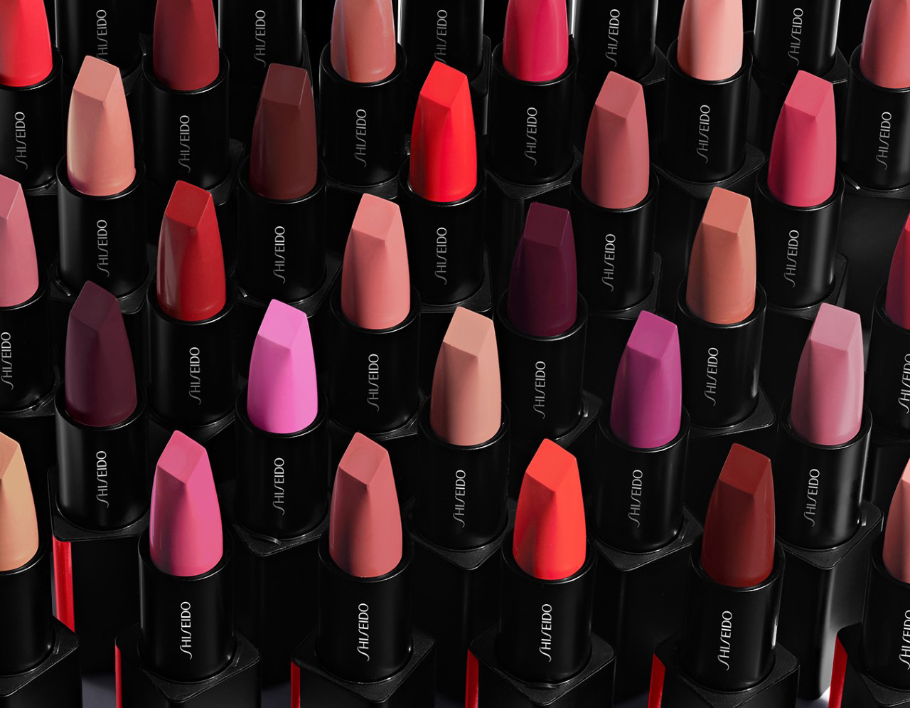KMA stylist Rachel Haas designs set for photo of many colorful lipsticks with black tubes for Shiseido