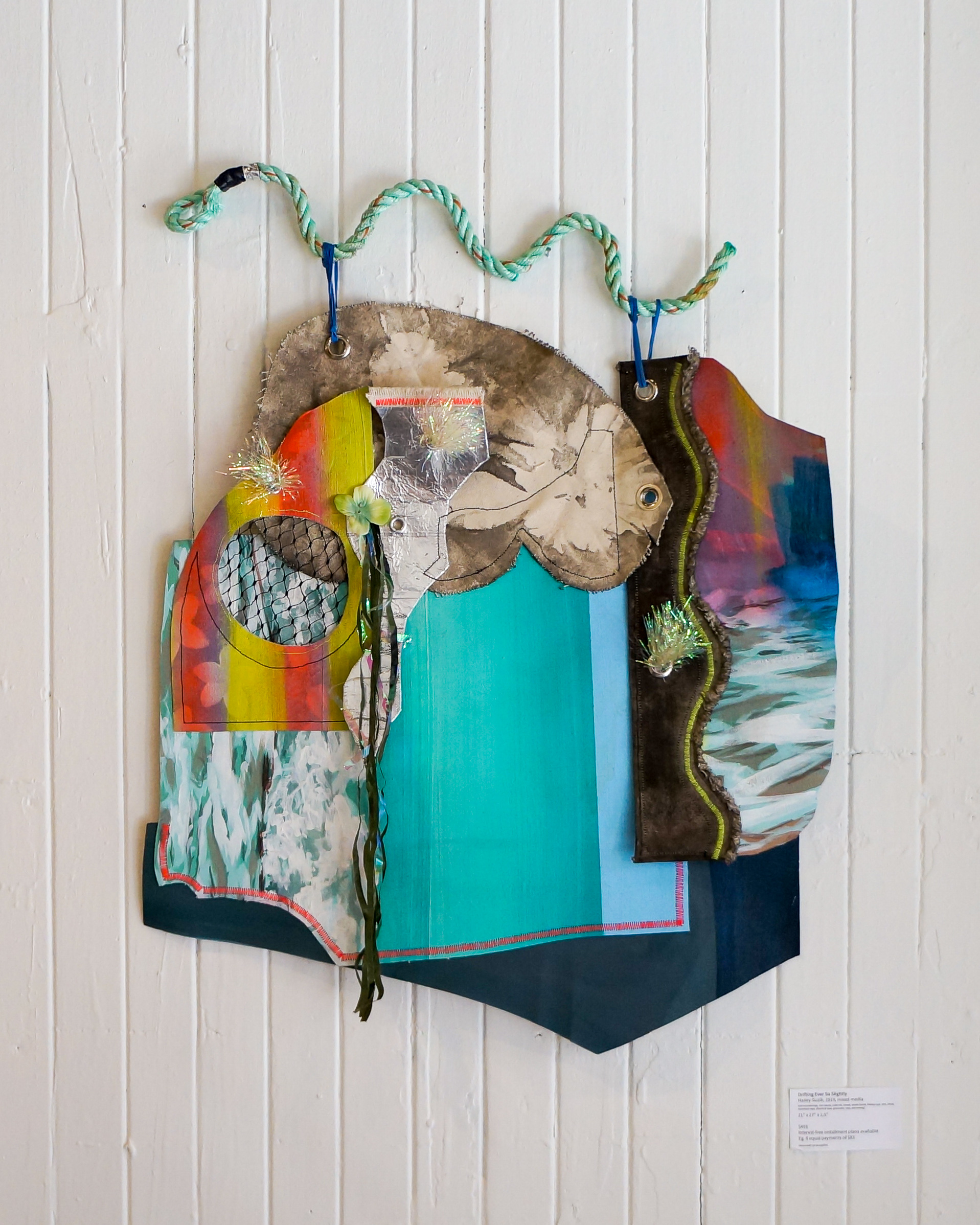 Drifting Ever So Slightly, cut-out paintings, raw canvas, india ink, thread, elastic bands, fishing rope, wire, tinsel, aluminum tape, electrical tape, grommets, tarp, and netting, 2019.