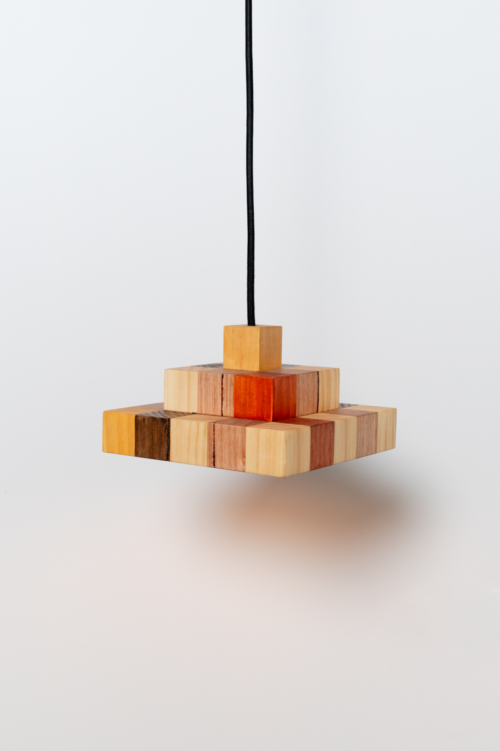 Jacqueline Stojanović & Hayden Stuart, Checkered Pendant (with red and yellow), 2024, Ink on Victorian Ash & Pine, Fabric Cable, E14 Light Fixture, (H) 12 x (W) 20 x (D) 20 cm