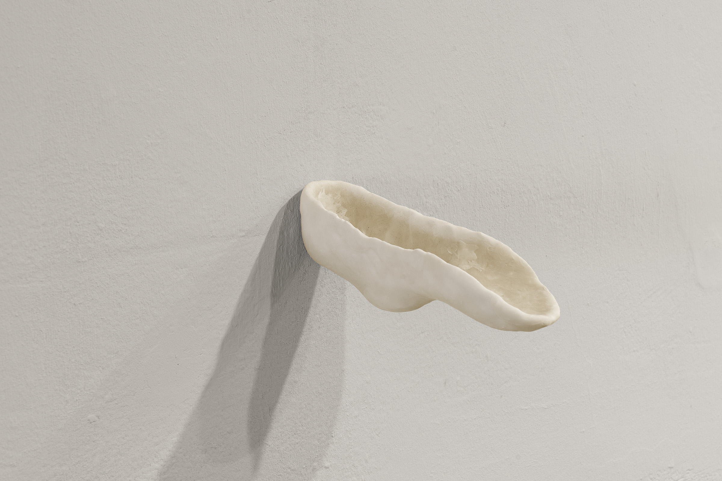 Bystanders (Public Ashtray), 2026. Acrylic One resin, air-dry porcelain, cigarettes and rubbish added by the passerby (outdoor installation). Various dimensions.