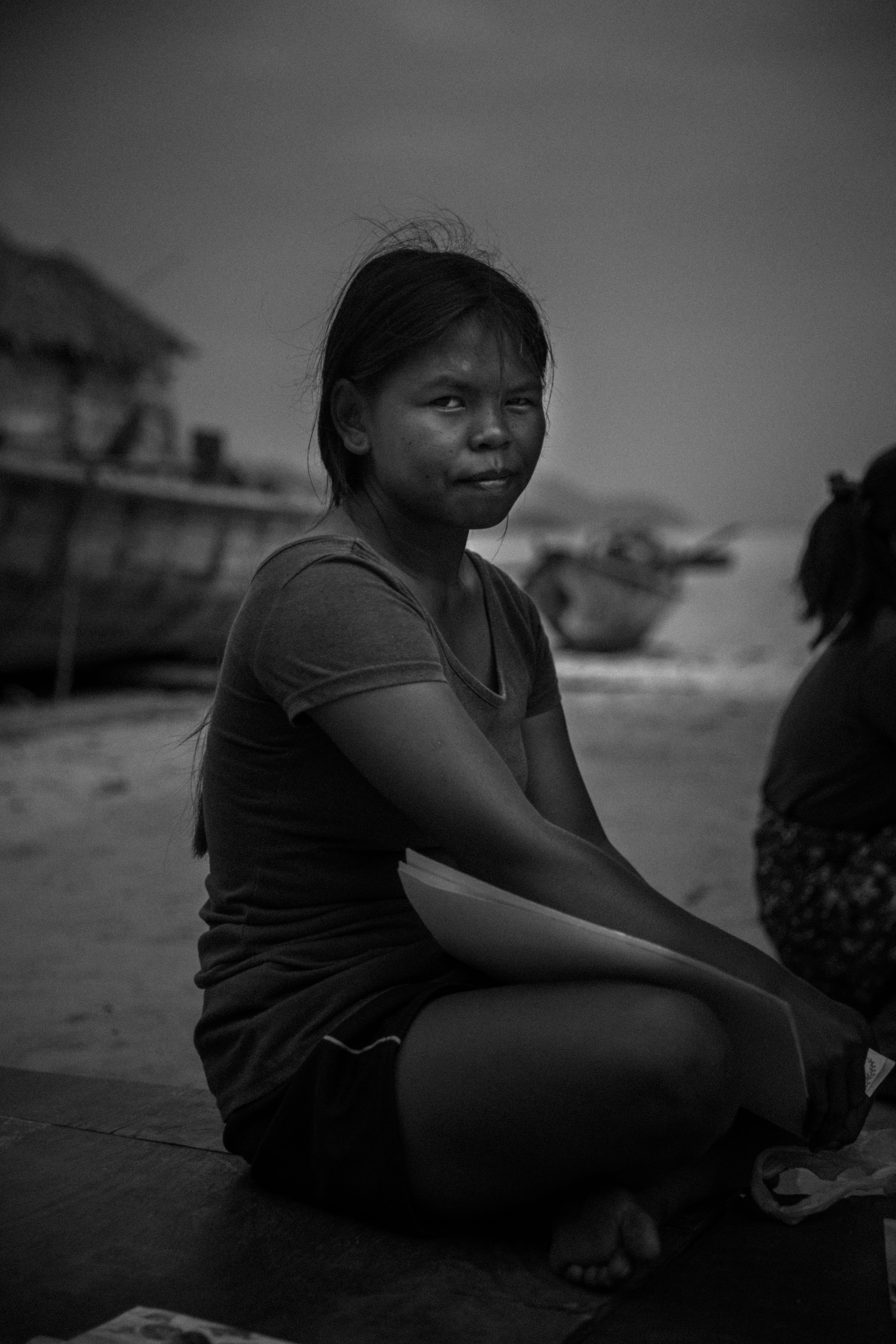 A young Moken woman sells handicrafts to tourists on South Surin Island, Thailand. January 2017.