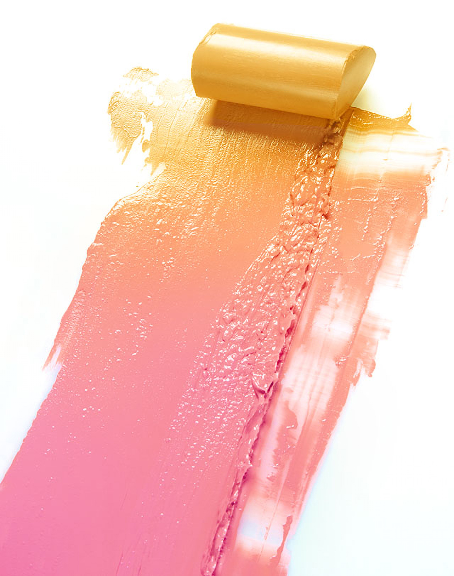 KMA photographer Daniel Schweizer shoots a texture photo of yellow and pink paint smeared on a white surface