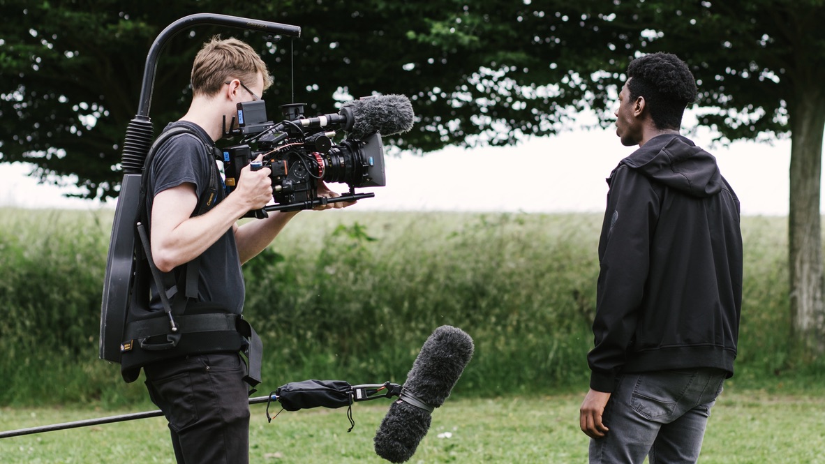 Cinematographer Jack Offord films a young performer.