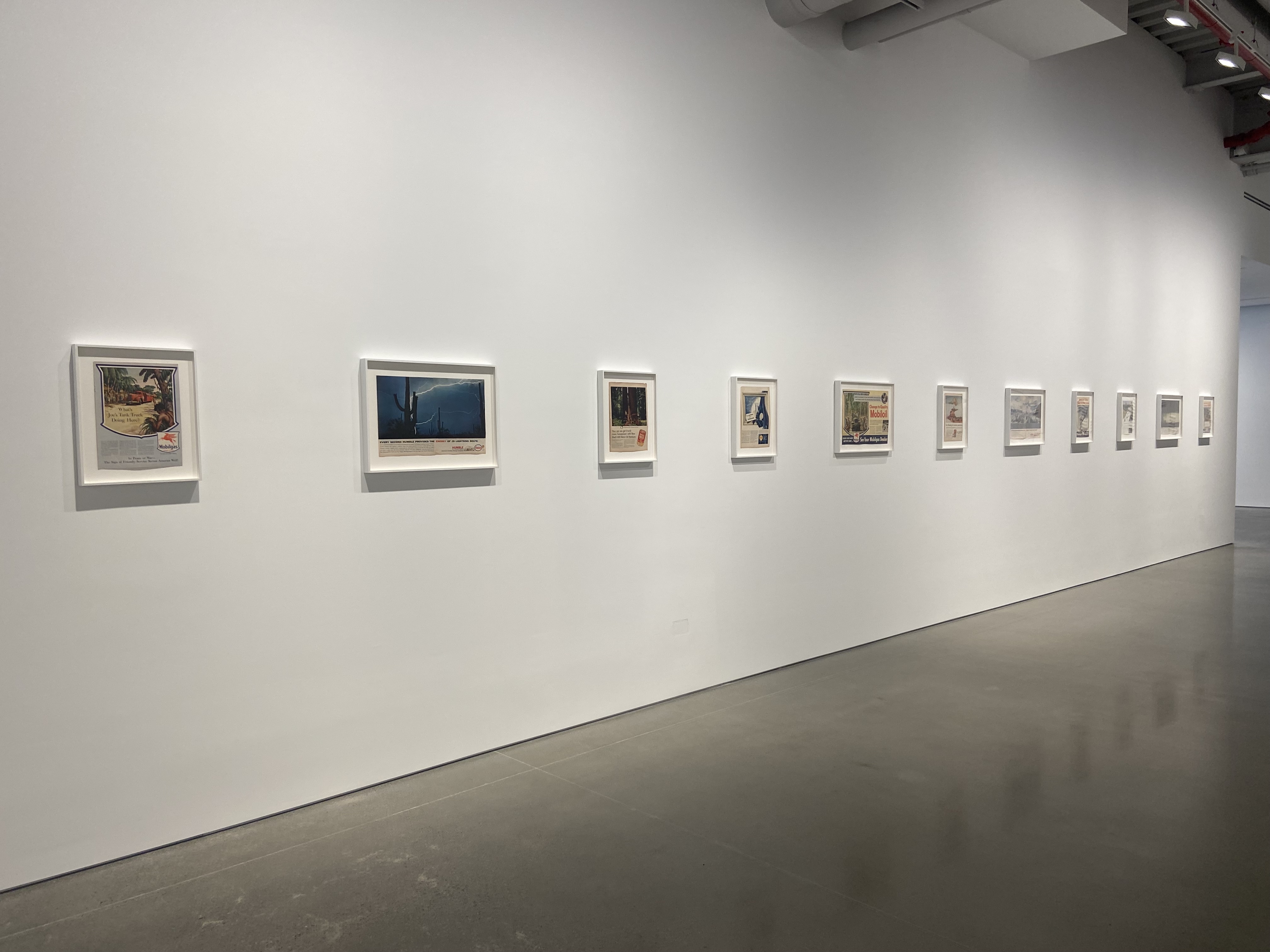 Installation view of vintage magazine works by Minerva Cuevas. Photo taken by the author (Madi Shenk).