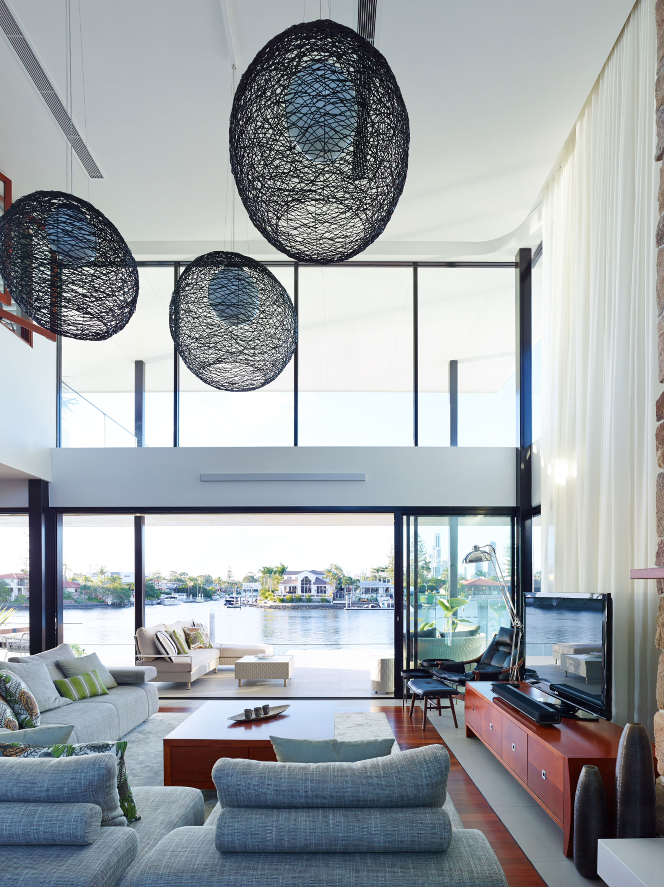 Canal views from the living space of a resort-style home on the Gold Coast.