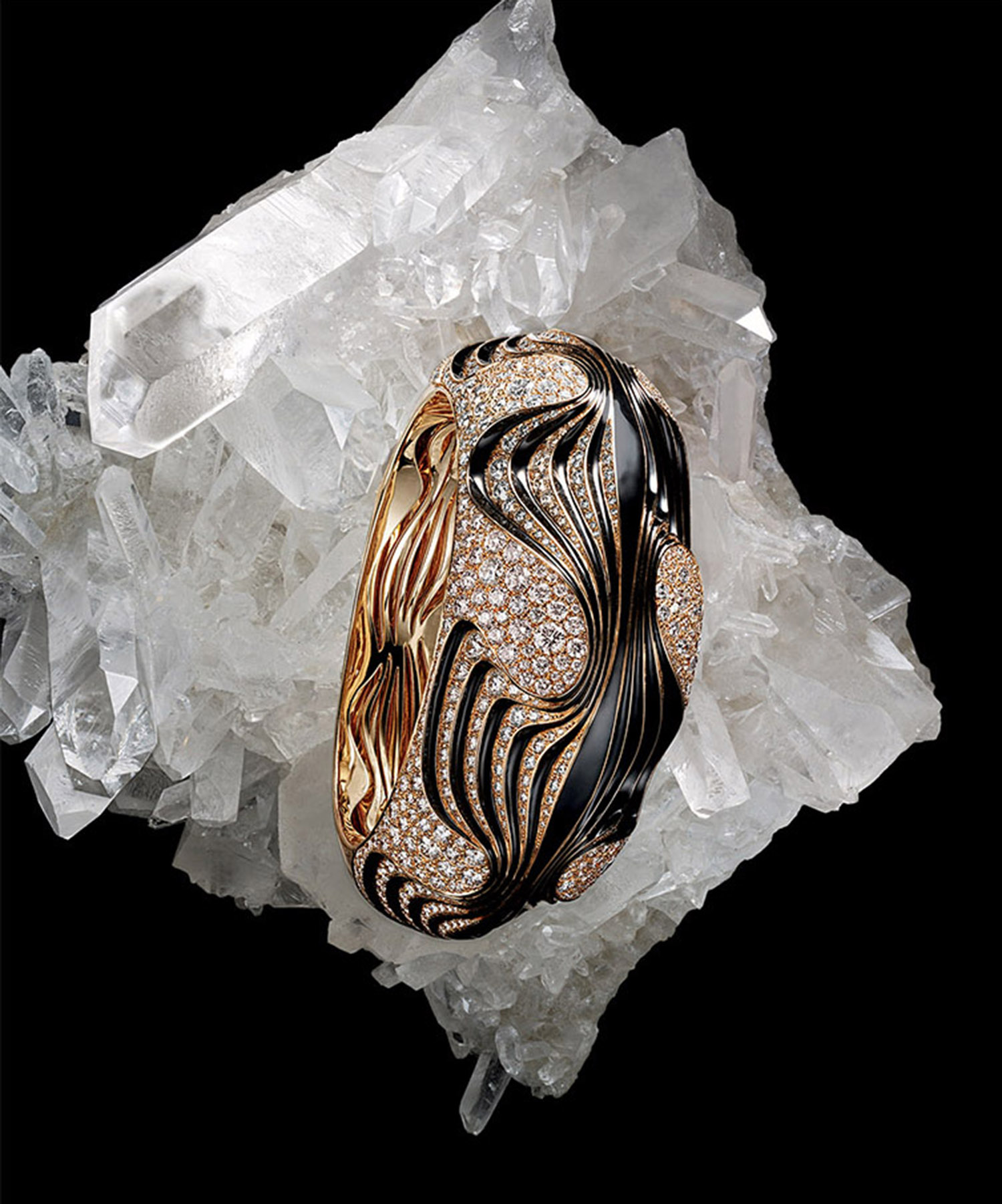 KMA stylist Sara Wacksman designs set for a photo of a black and gold diamond ring laying on a clear crystal