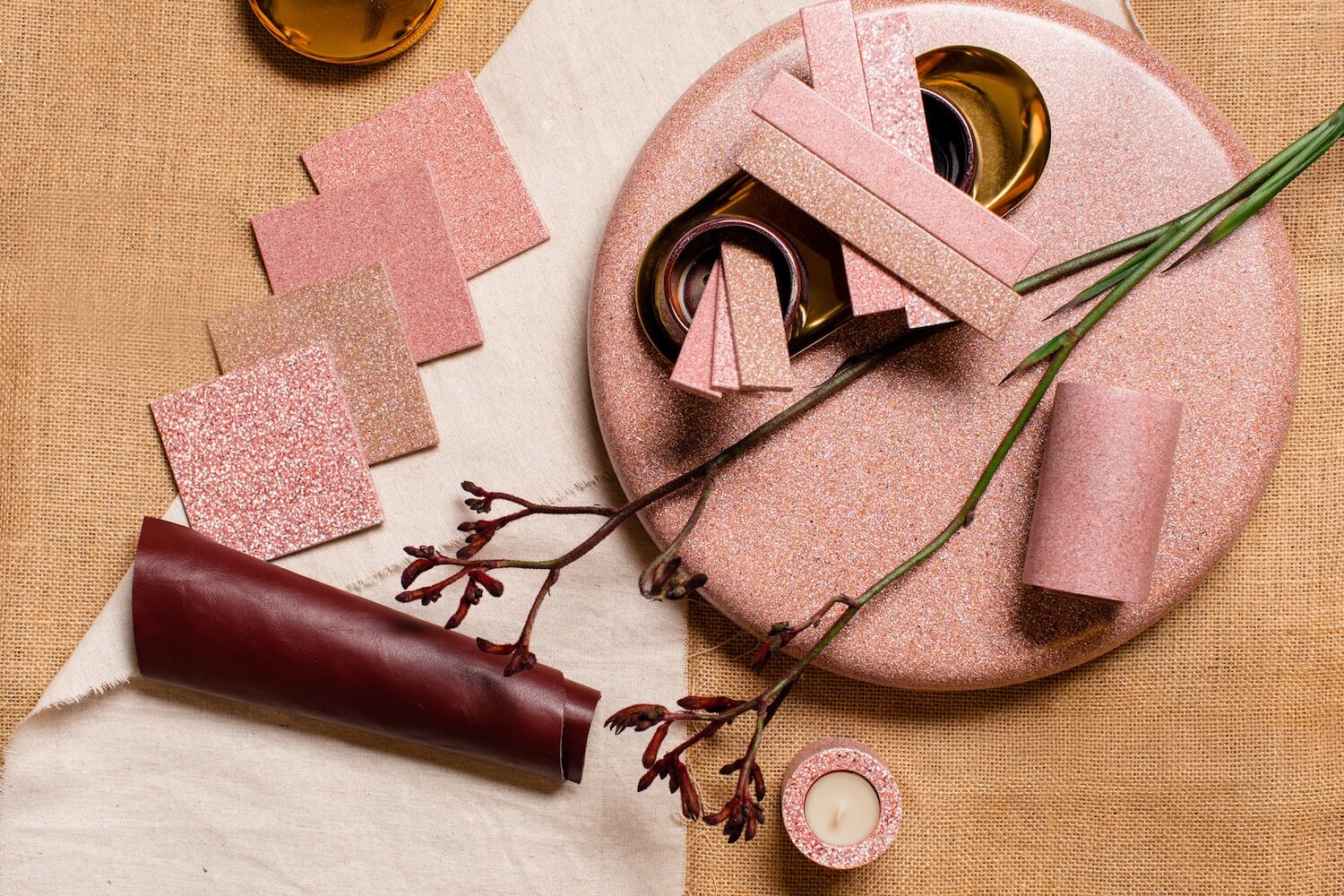 A selection of natural material samples in pink tones