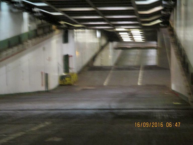 A blurry photo of the inside of the Atlantic Conveyor. It shows a long ramp that seems to be a loading bay. The time stamp reads: "16/09/2016 06:47"