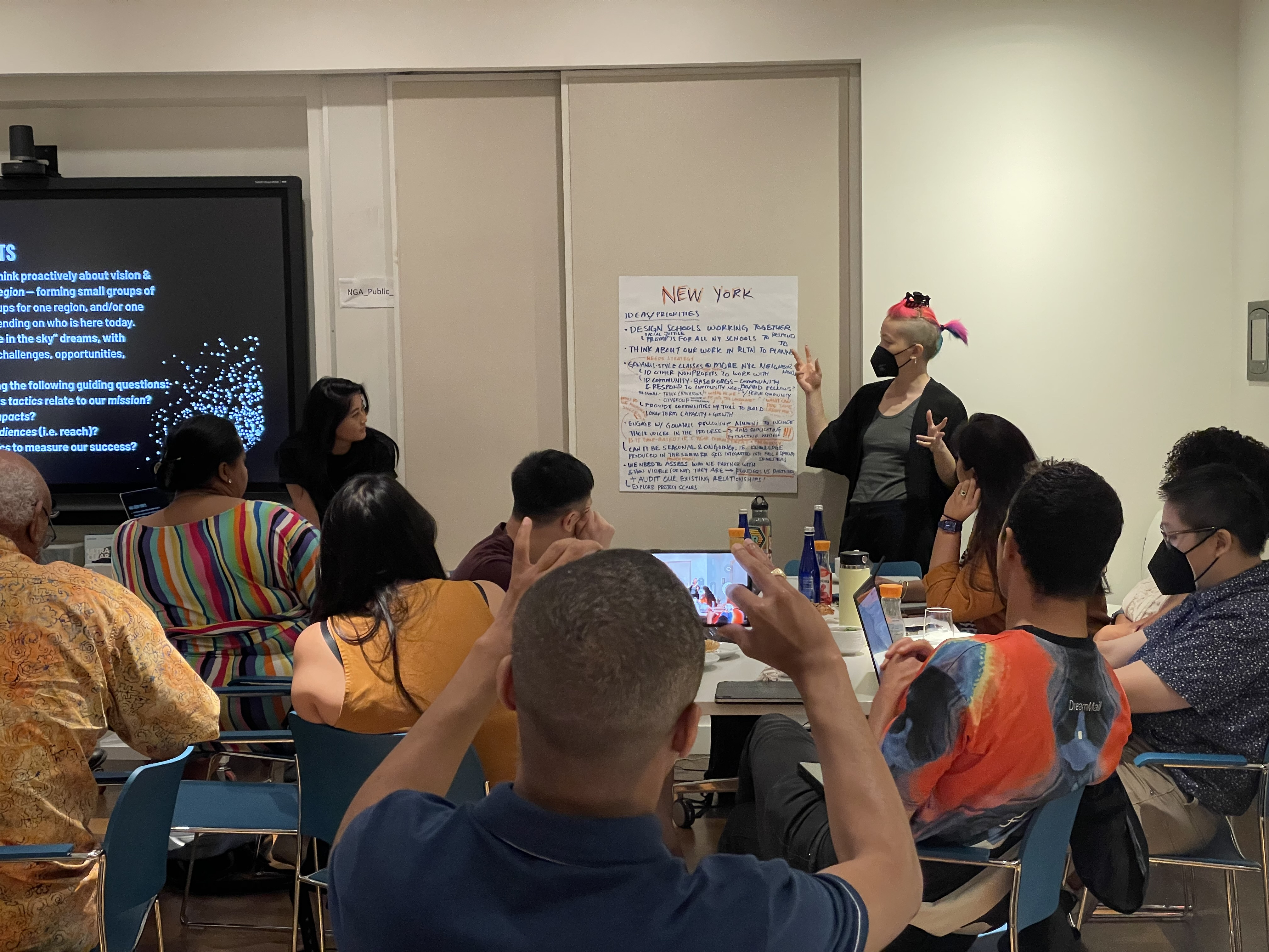 With pink hair, at the 2023 Dark Matter U Retreat