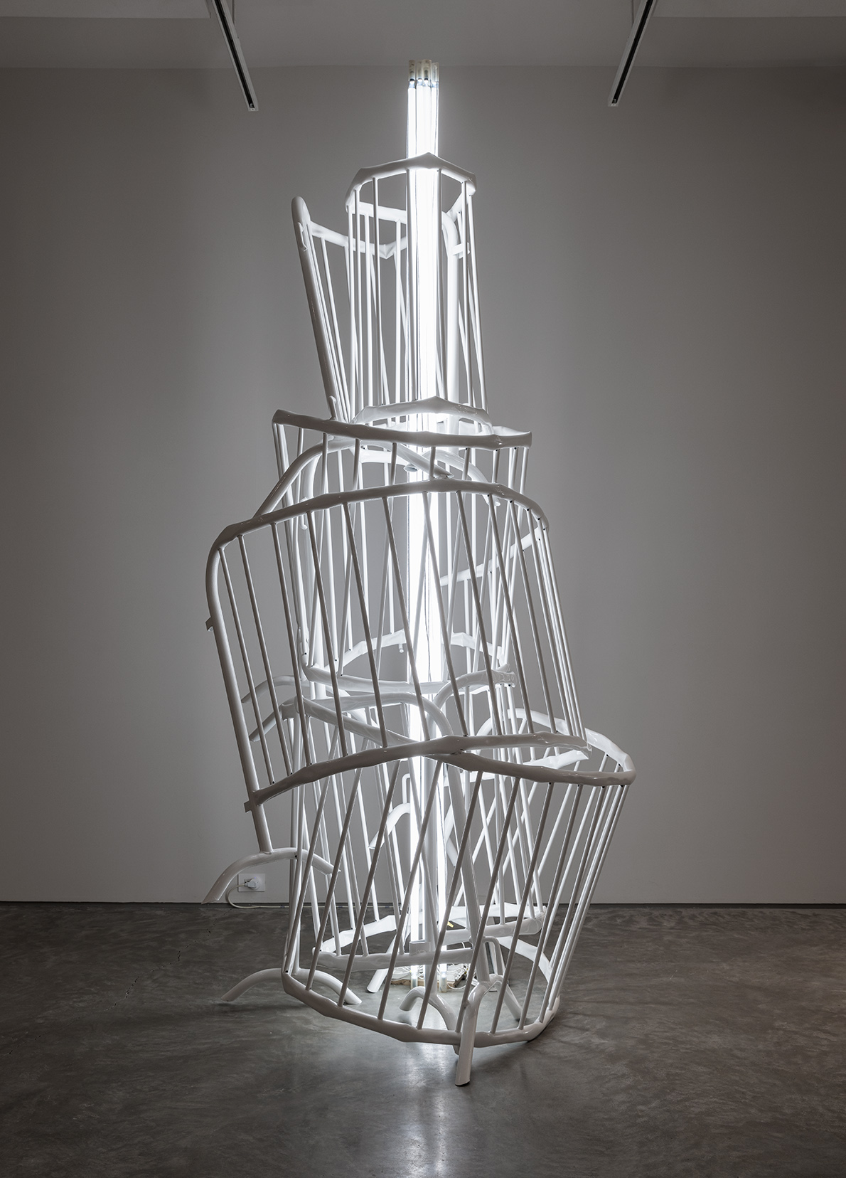 Bettina Pouttschi, "Double Monuments for Flavin and Tatlin X," 2013. Powder-coated crowd barriers, neon light, 112 1/4 x 55 x 59 inches. Courtesy of Nasher Sculpture Center. Purchased with the support of Mr. and Mrs. Buhl, Frankfurt, Germany; THE EKARD COLLECTION; Brigitte and Henning Freybe, West Vancouver, B.C.; Liselotte and Alfredo Gysi; Wemhöner Collection; and an anonymous donor. Photo by Etienne Frossard.